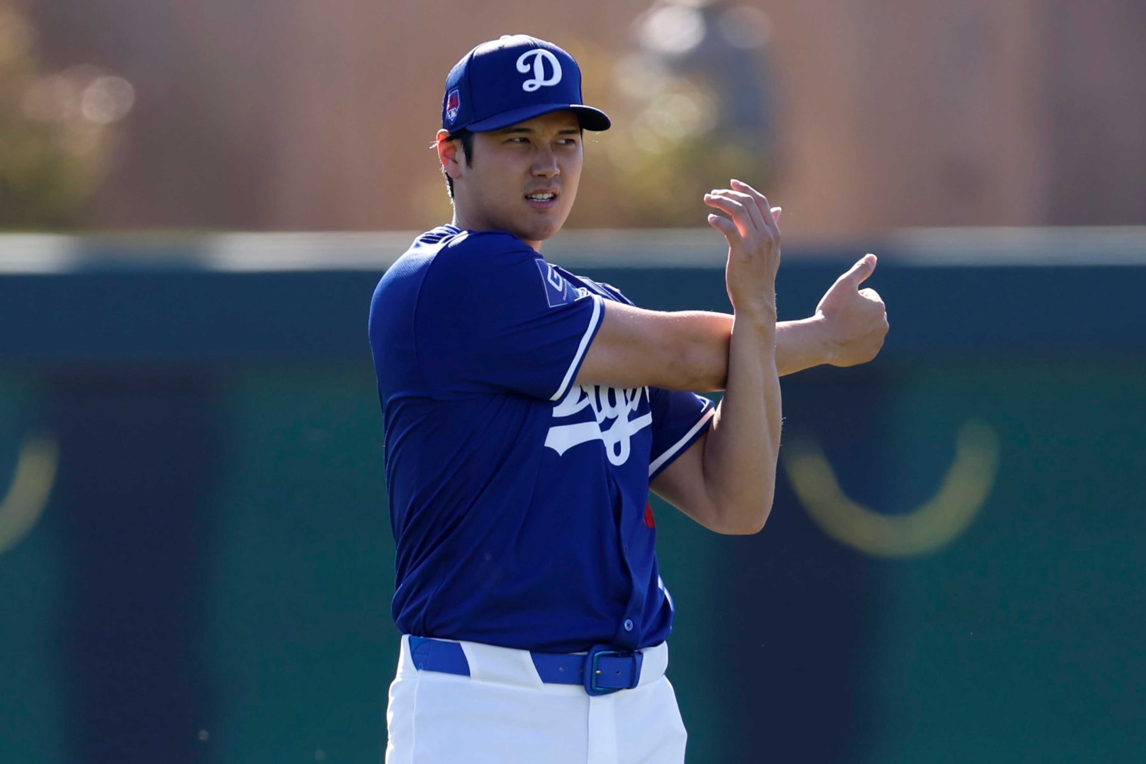 GLENDALE, ARIZONA - FEBRUARY 14: Shohei Ohtani #17 of the Los Angeles Dodgers stretches during workouts at Camelback Ranch on February 14, 2024 in Glendale, Arizona. (Photo by Chris Coduto/Getty Images) GLENDALE, ARIZONA - FEBRUARY 14: Shohei Ohtani #17 of the Los Angeles Dodgers stretches during workouts at Camelback Ranch on February 14, 2024 in Glendale, Arizona. (Photo by Chris Coduto/Getty Images)