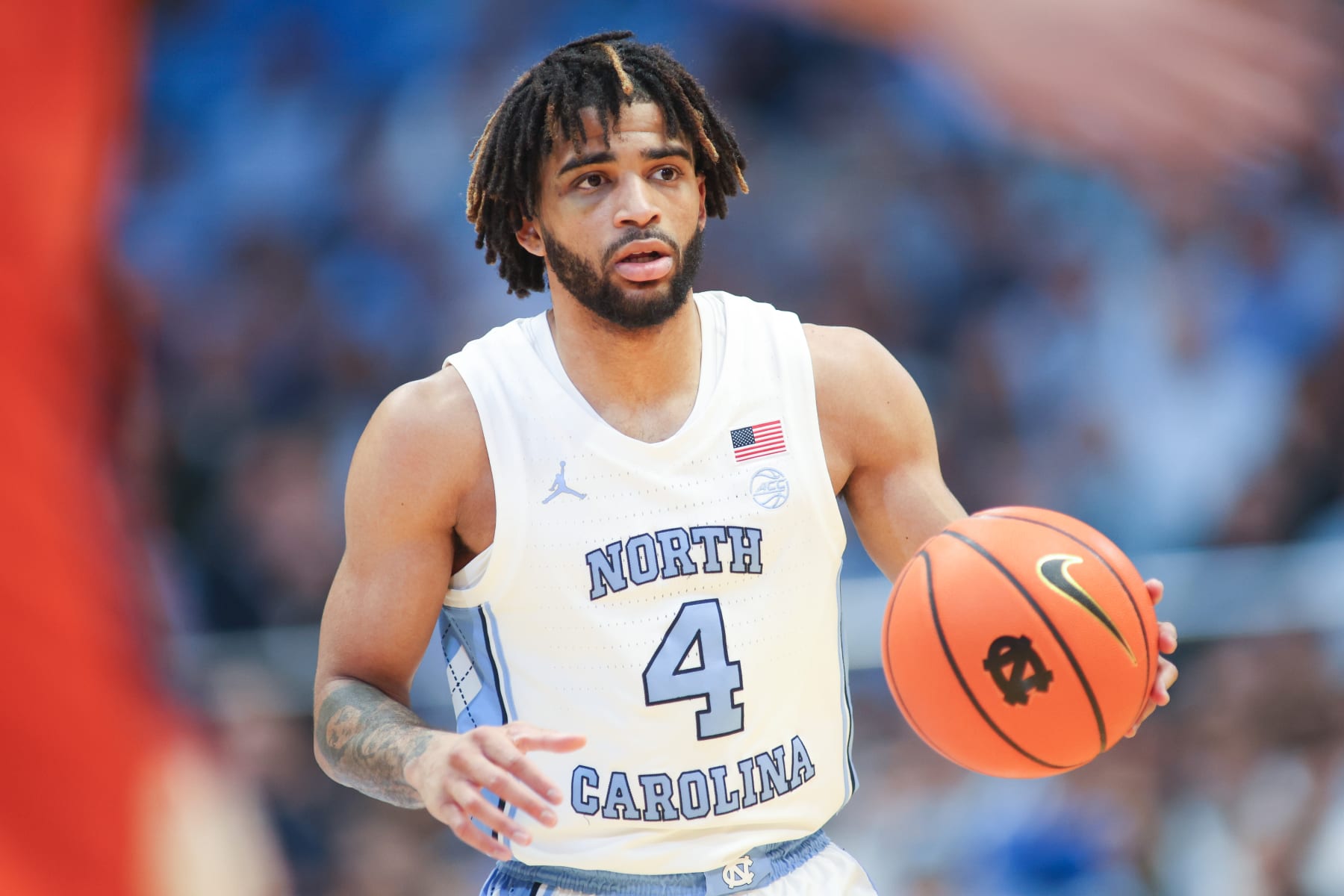 RALEIGH, NC - NOVEMBER 04: North Carolina Tar Heels guard RJ Davis (4) brings the ball up court during the college football game between the North Carolina State Wolfpack and the Miami Hurricanes on November 4, 2023 at Carter-Finley Stadium in Raleigh, NC. (Photo by Nicholas Faulkner/Icon Sportswire via Getty Images)