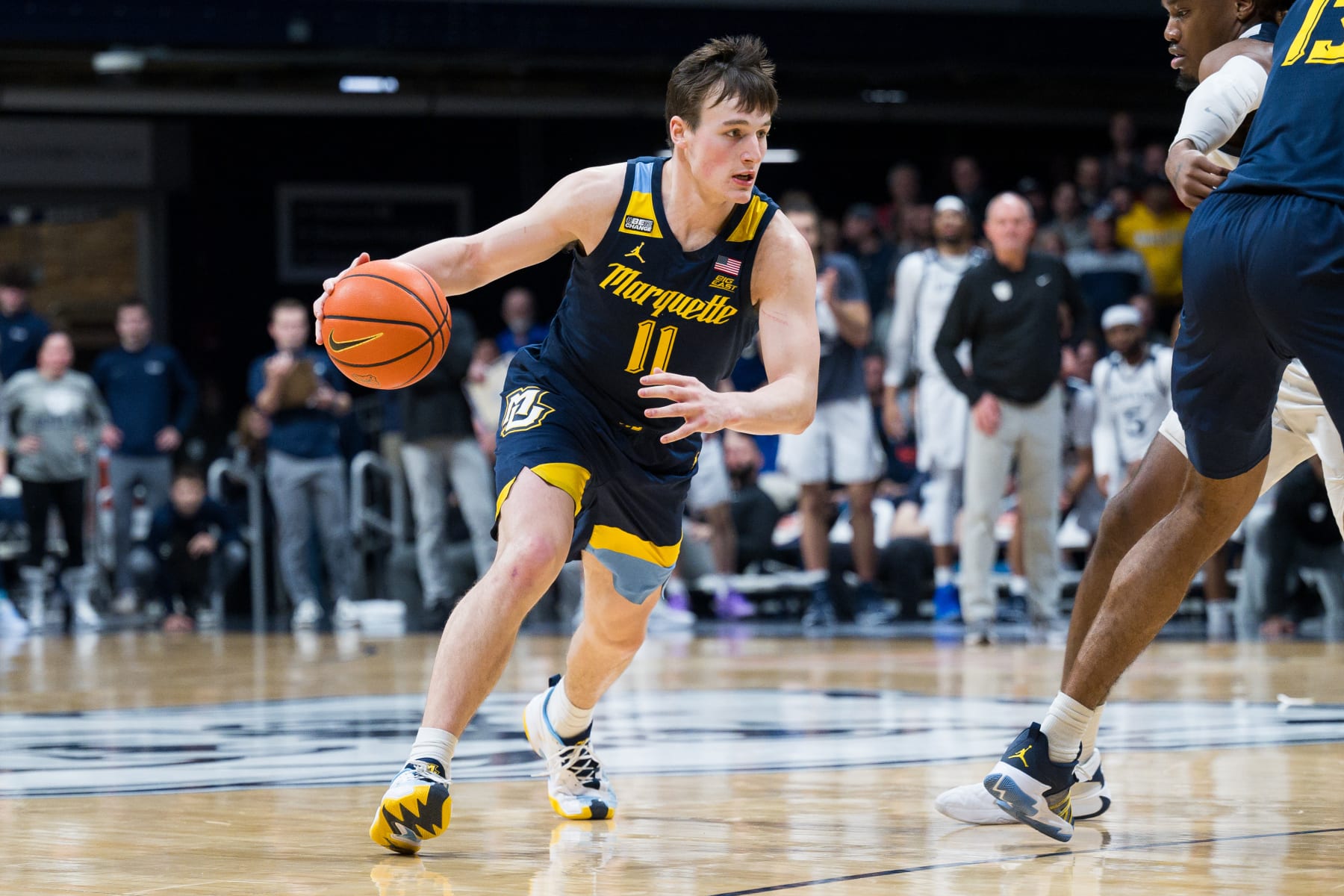 INDIANAPOLIS, IN - FEBRUARY 13: Marquette Golden Eagles guard Tyler Kolek (11) dribbles down the court during the men's college basketball game between the Butler Bulldogs and Marquette Golden Eagles on February 13, 2024, at Hinkle Fieldhouse in Indianapolis, IN. (Photo by Zach Bolinger/Icon Sportswire via Getty Images)