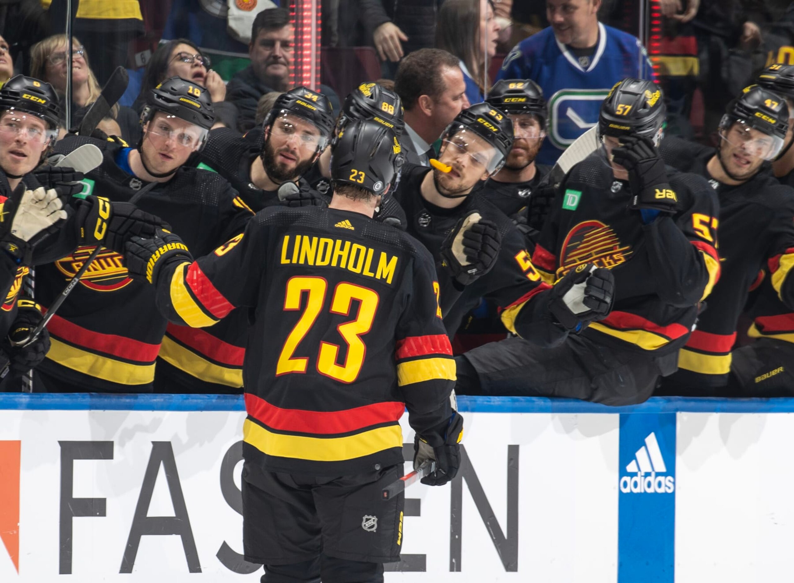 VANCOUVER, CANADA - FEBRUARY 15: Elias Lindholm #23 of the Vancouver Canucks celebrates his goal with teammates during the third period of their NHL game against the Detroit Red Wings at Rogers Arena on February 15, 2024 in Vancouver, British Columbia, Canada.  (Photo by Jeff Vinnick/NHLI via Getty Images)