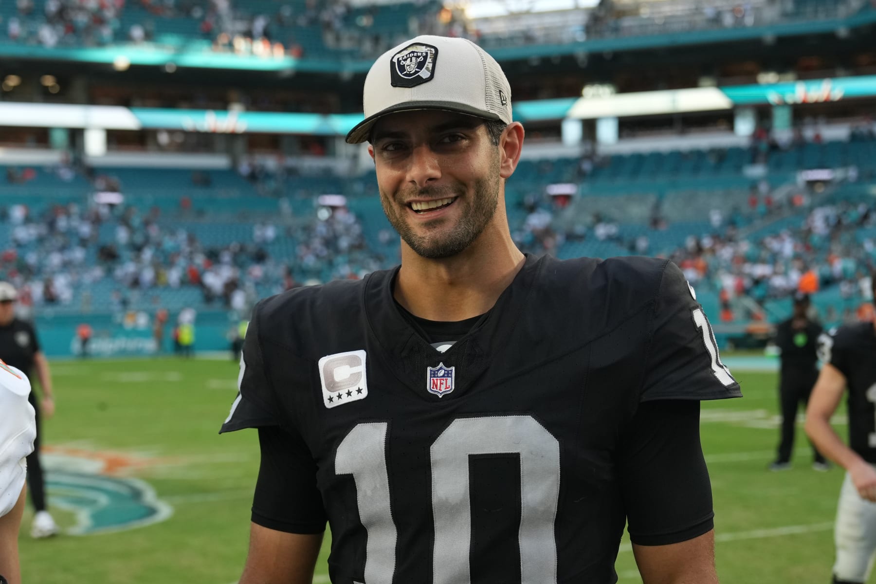 MIAMI GARDENS, FL - NOVEMBER 19: Las Vegas Raiders quarterback Jimmy Garoppolo (10) smiles for a photo following the game between the Las Vegas Raiders and the Miami Dolphins on Sunday, November 19, 2023 at Hard Rock Stadium, Miami, Fla. (Photo by Peter Joneleit/Icon Sportswire via Getty Images)