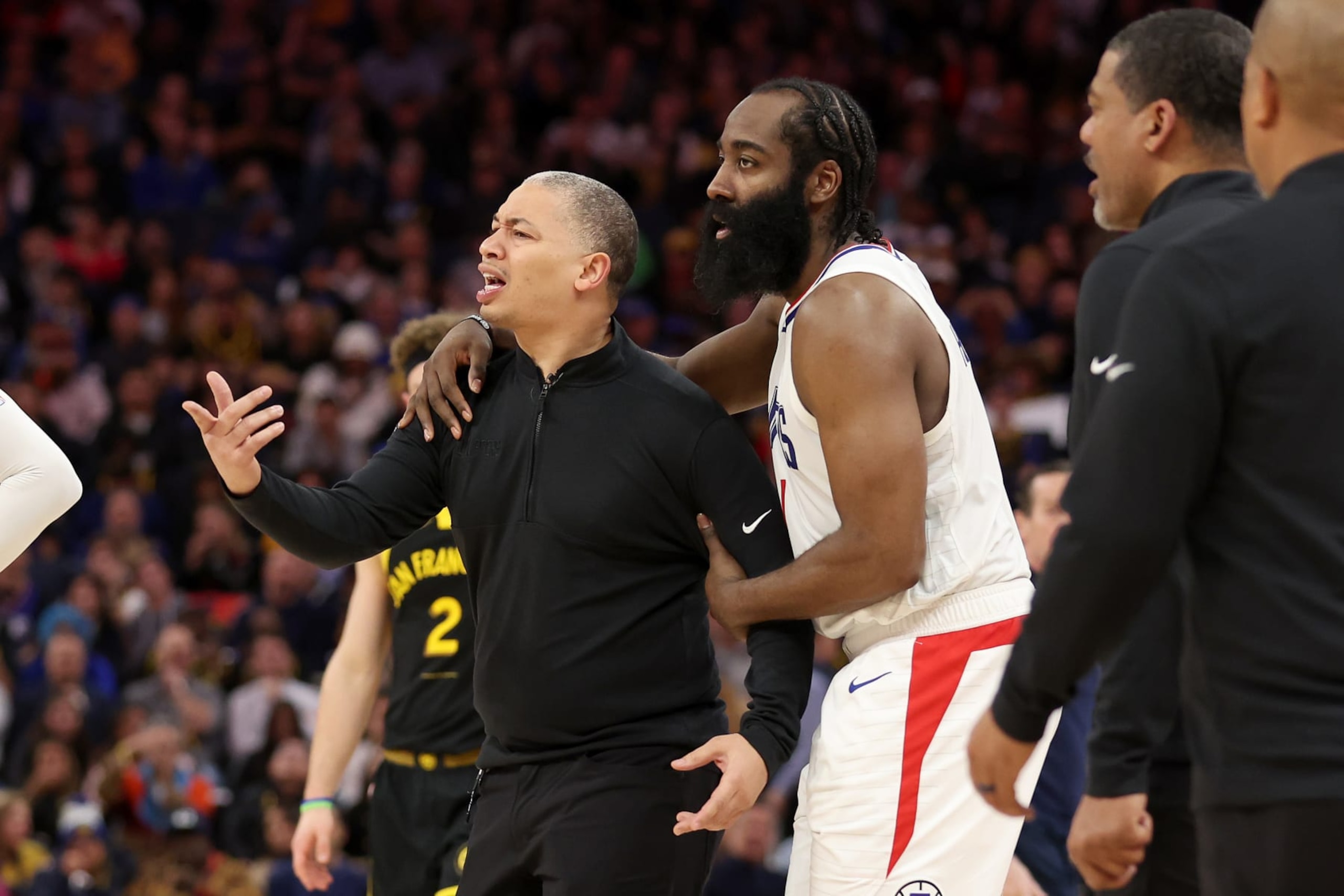 SAN FRANCISCO, CALIFORNIA - FEBRUARY 14:  James Harden #1 of the LA Clippers holds back head coach Tyronn Lue, who was complaining about a call, during their game against the Golden State Warriors in the second half at Chase Center on February 14, 2024 in San Francisco, California. NOTE TO USER: User expressly acknowledges and agrees that, by downloading and or using this photograph, User is consenting to the terms and conditions of the Getty Images License Agreement.  (Photo by Ezra Shaw/Getty Images)