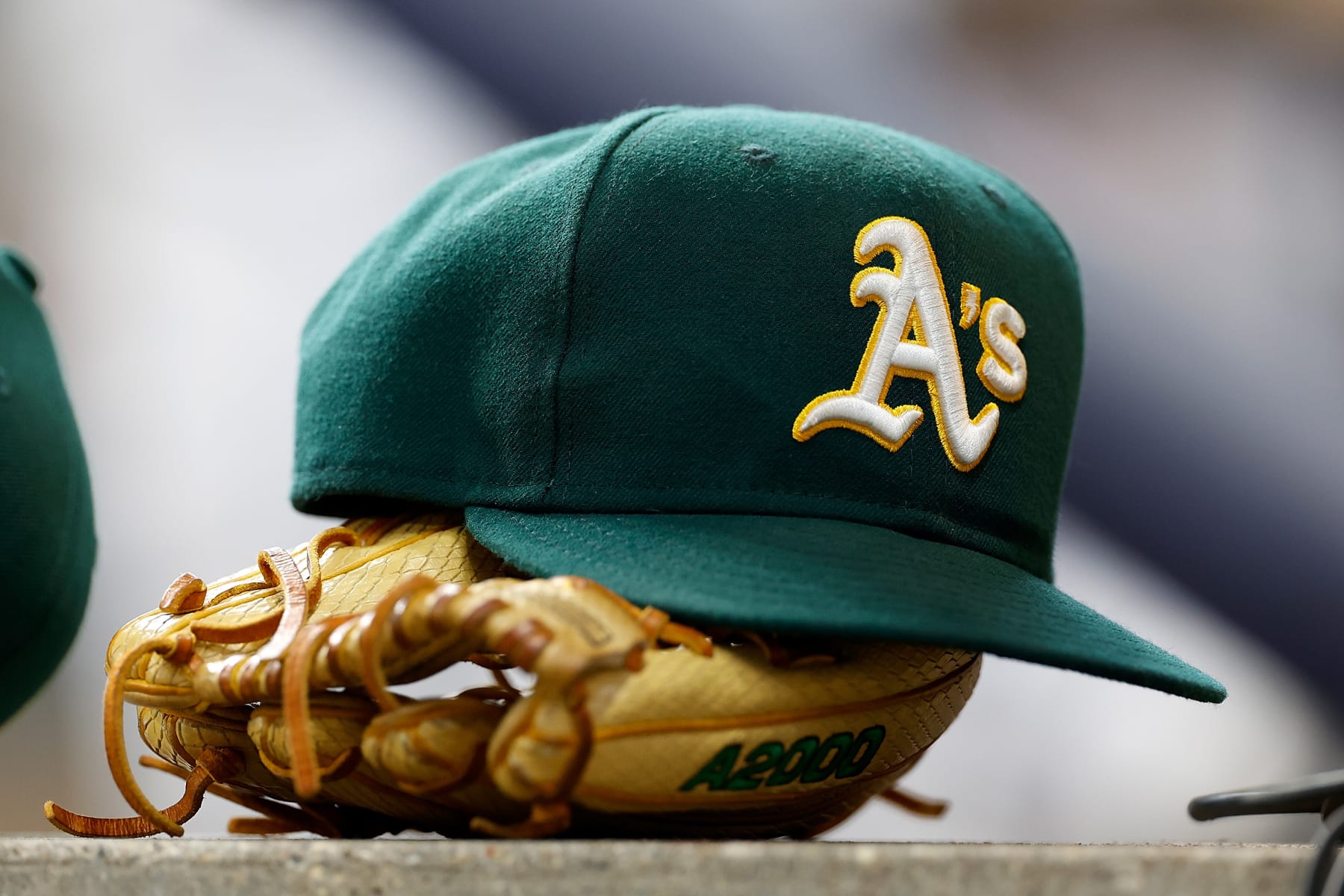 MILWAUKEE, WISCONSIN - JUNE 11: A picture of the Oakland Athletics baseball hat on the dugout step before the game against the Milwaukee Brewers at American Family Field on June 11, 2023 in Milwaukee, Wisconsin. (Photo by John Fisher/Getty Images)