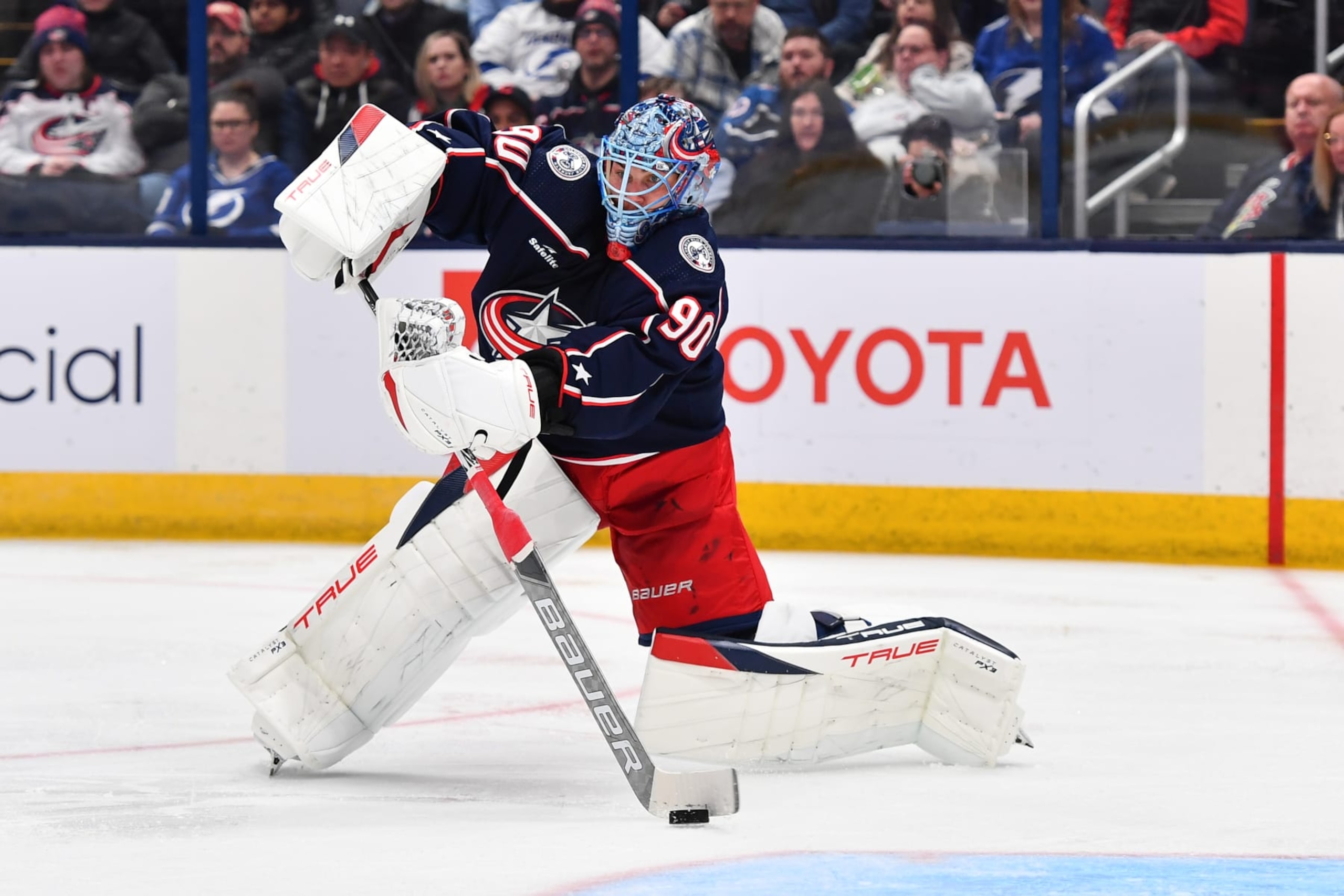 COLUMBUS, OHIO - FEBRUARY 10: Goaltender Elvis Merzlikins #90 of the Columbus Blue Jackets plays the puck during the second period of a game against the Tampa Bay Lightning at Nationwide Arena on February 10, 2024 in Columbus, Ohio. (Photo by Ben Jackson/NHLI via Getty Images)