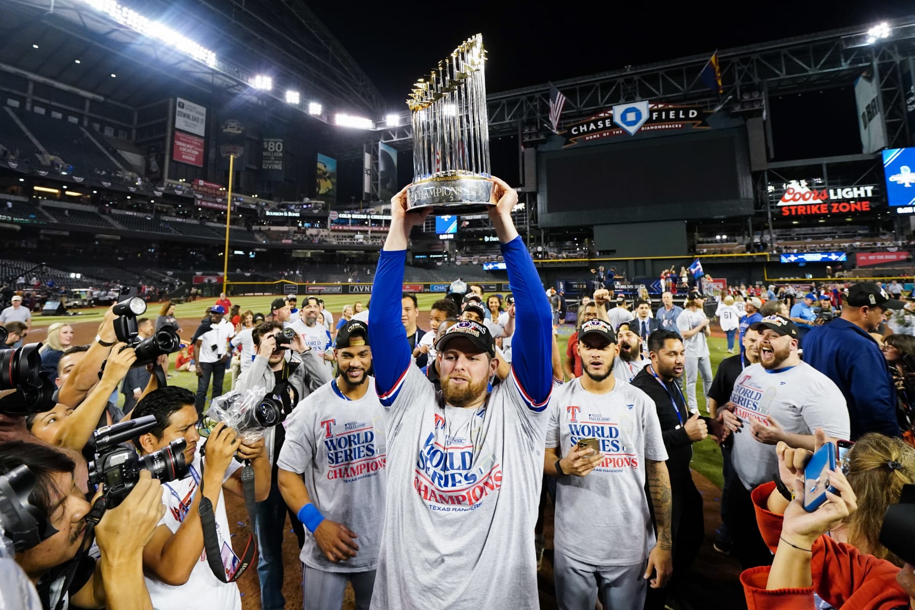 PHOENIX, AZ - NOVEMBER 01:   Jordan Montgomery #52 of the Texas Rangers holds up the Commissioner's Trophy after winning Game 5 of the 2023 World Series between the Texas Rangers and the Arizona Diamondbacks at Chase Field on Wednesday, November 1, 2023 in Phoenix, Arizona. The Rangers defeated the Diamondbacks 5-0 to win the World Series. (Photo by Rob Tringali/MLB Photos via Getty Images)