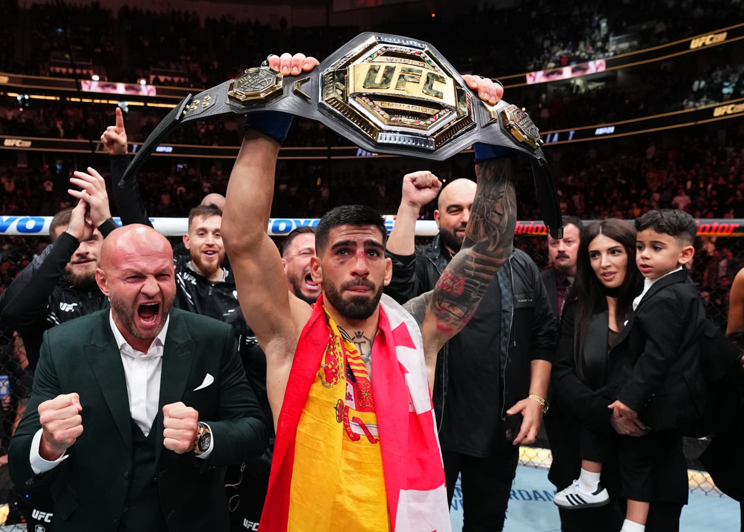 ANAHEIM, CALIFORNIA - FEBRUARY 17: Ilia Topuria of Germany celebrates after his knockout victory against Alexander Volkanovski of Australia in the UFC featherweight championship fight during the UFC 298 event at Honda Center on February 17, 2024 in Anaheim, California. (Photo by Chris Unger/Zuffa LLC via Getty Images)