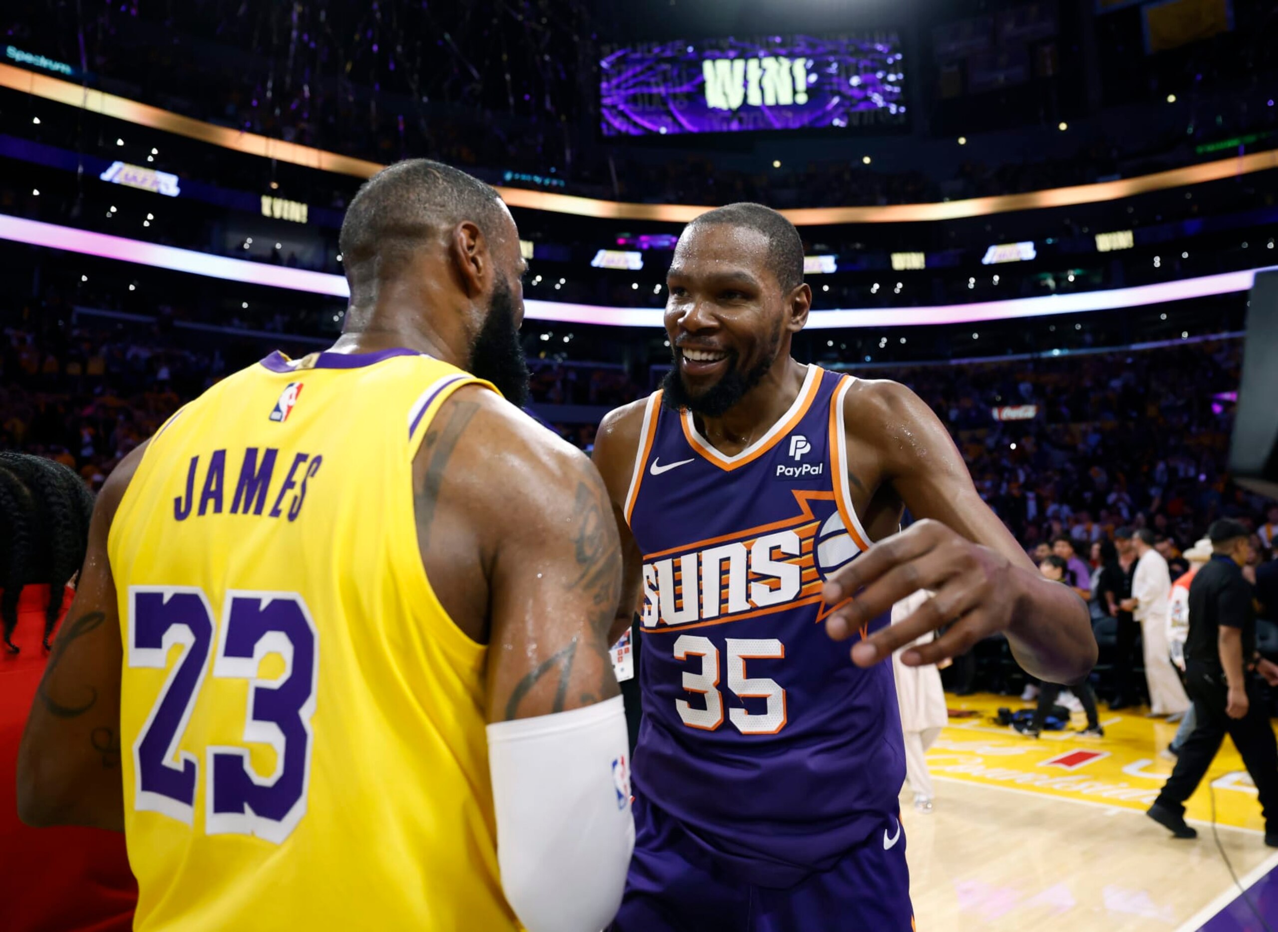 LOS ANGELES, CALIFORNIA - OCTOBER 26: Kevin Durant #35 of the Phoenix Suns and LeBron James #23 of the Los Angeles Lakers hug after the Lakers defeated the Suns, 100-95, at Crypto.com Arena on October 26, 2023 in Los Angeles, California. Durant scored a game high 39 points. NOTE TO USER: User expressly acknowledges and agrees that, by downloading and or using this photograph, User is consenting to the terms and conditions of the Getty Images License Agreement. (Photo by Kevork Djansezian/Getty Images)