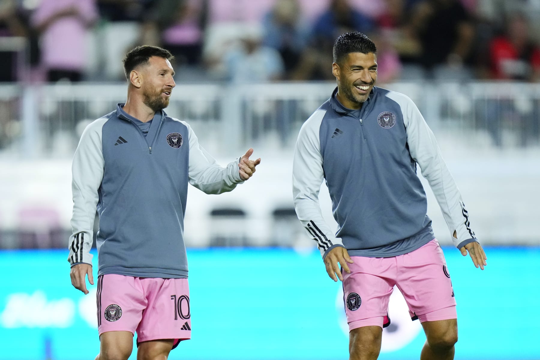 FORT LAUDERDALE, FLORIDA - FEBRUARY 15: Lionel Messi #10 and Luis Suárez #9 of Inter Miami CF warm up before a friendly match against Newell's Old Boys at DRV PNK Stadium on February 15, 2024 in Fort Lauderdale, Florida. (Photo by Rich Storry/Getty Images)