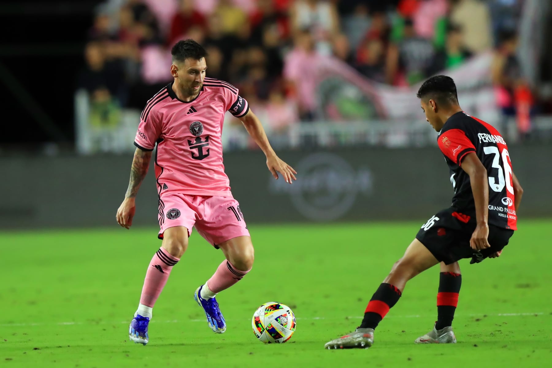 FORT LAUDERDALE, FL - FEBRUARY 15: Inter Miami Forward Lionel Leo Messi (10) controls the ball as Newell's Old Boys Midfielder Esteban Fernández (36) defends during the preseason match between Inter Miami CF vs Newell's Old Boys on February 15, 2024 at DRV PNK Stadium in Fort Lauderdale, Florida. (Photo by Cliff Welch/Icon Sportswire via Getty Images)