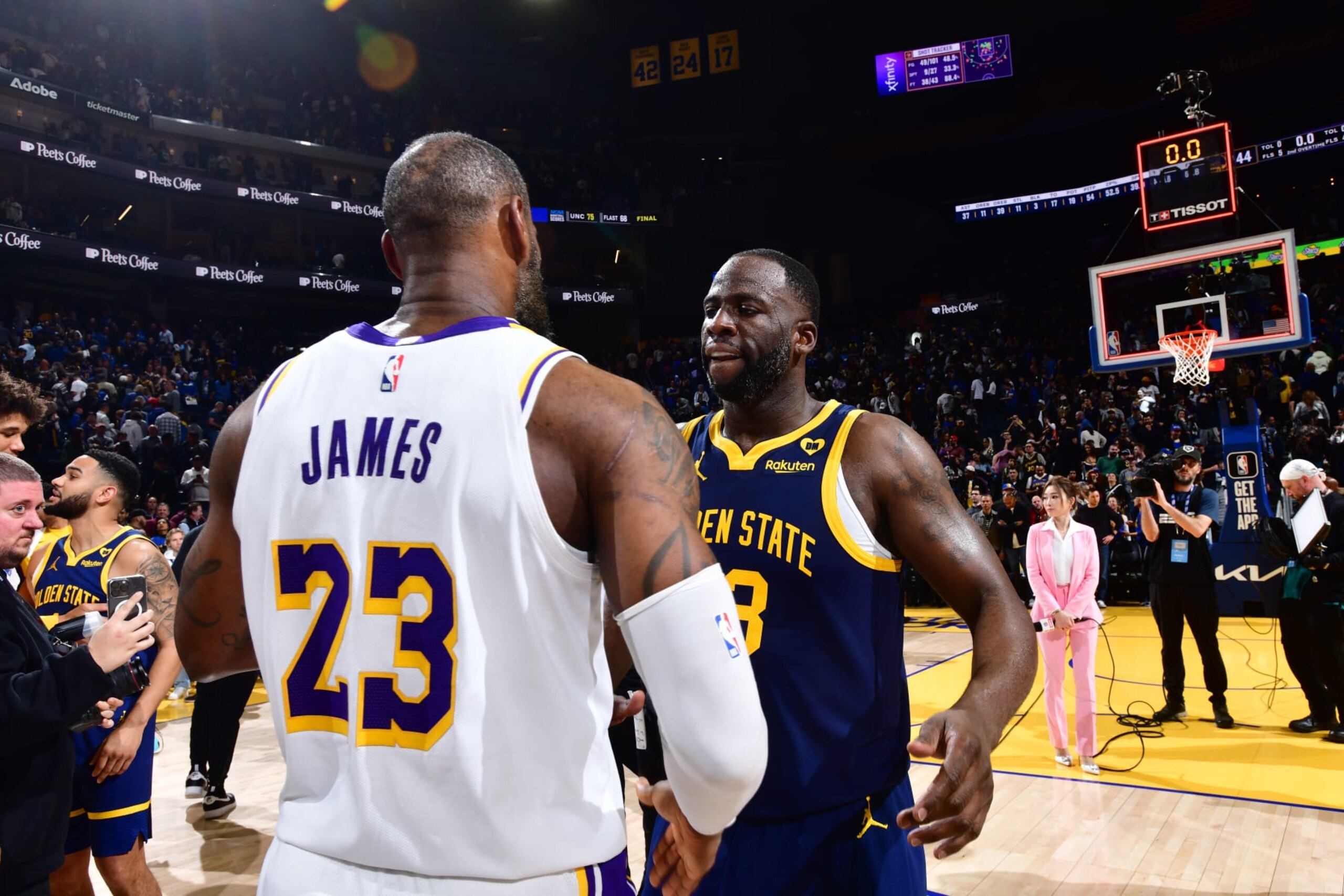 SAN FRANCISCO, CA - JANUARY 27:  LeBron James #23 of the Los Angeles Lakers and Draymond Green #23 of the Golden State Warriors meet after the game on January 27, 2024 at Chase Center in San Francisco, California. NOTE TO USER: User expressly acknowledges and agrees that, by downloading and or using this photograph, user is consenting to the terms and conditions of Getty Images License Agreement. Mandatory Copyright Notice: Copyright 2024 NBAE (Photo by Barry Gossage/NBAE via Getty Images)