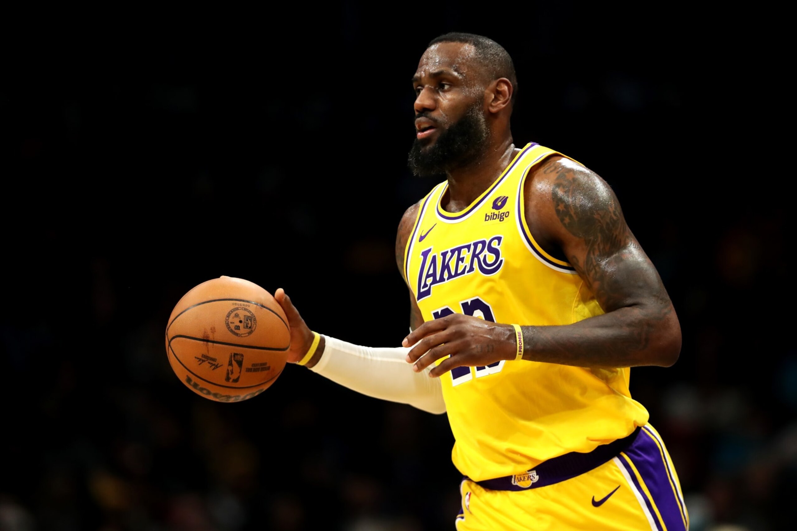 CHARLOTTE, NORTH CAROLINA - FEBRUARY 05: LeBron James #23 of the Los Angeles Lakers brings the ball down the court during the first half of an NBA game against the Charlotte Hornets at Spectrum Center on February 05, 2024 in Charlotte, North Carolina. NOTE TO USER: User expressly acknowledges and agrees that, by downloading and or using this photograph, User is consenting to the terms and conditions of the Getty Images License Agreement. (Photo by David Jensen/Getty Images)