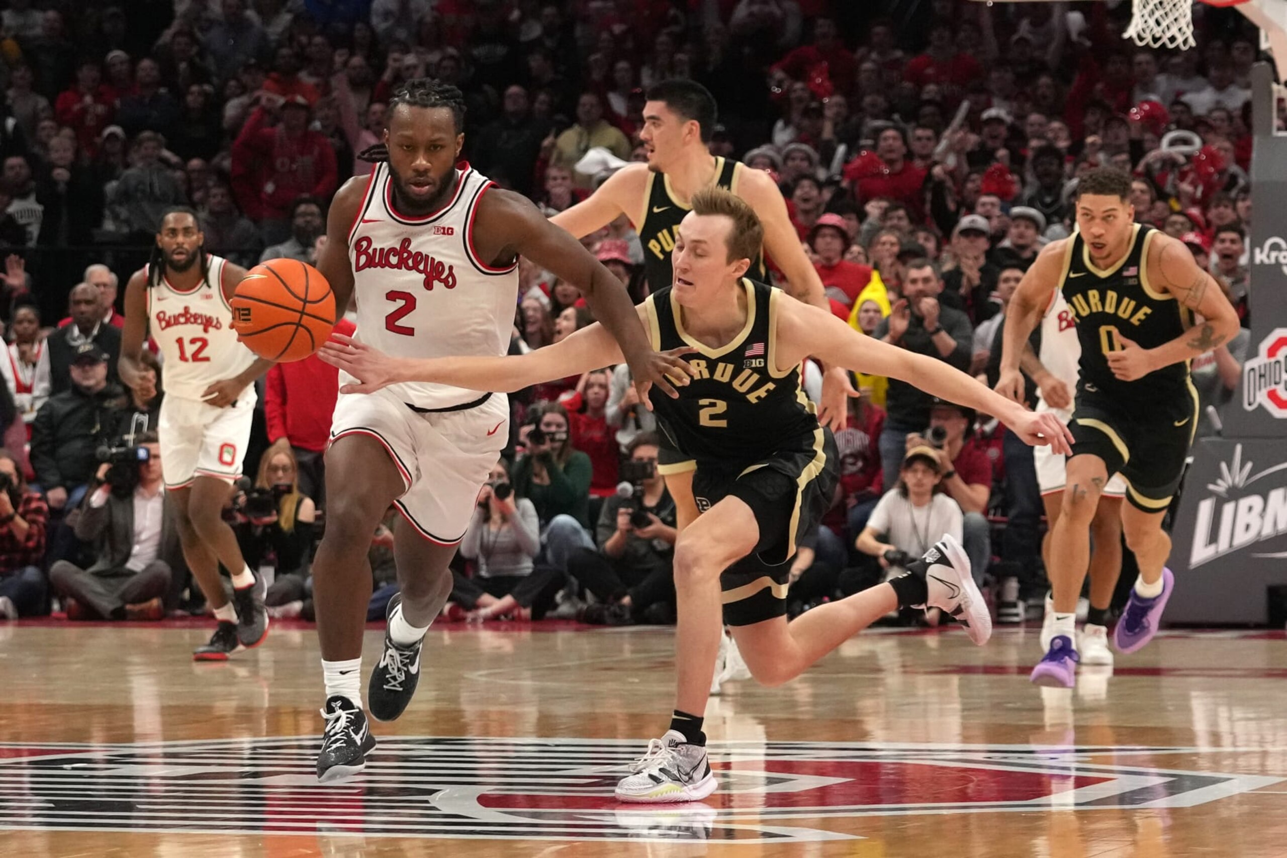 COLUMBUS, OH - FEBRUARY 18: Fletcher Loyer #2 of the Purdue Boilermakers fouls Bruce Thornton #2 of the Ohio State Buckeyes as he dribbles down the court during the second half at Value City Arena in Columbus, Ohio on February 18, 2024. (Photo by Jason Mowry/Icon Sportswire via Getty Images) COLUMBUS, OH - FEBRUARY 18: Fletcher Loyer #2 of the Purdue Boilermakers fouls Bruce Thornton #2 of the Ohio State Buckeyes as he dribbles down the court during the second half at Value City Arena in Columbus, Ohio on February 18, 2024. (Photo by Jason Mowry/Icon Sportswire via Getty Images)