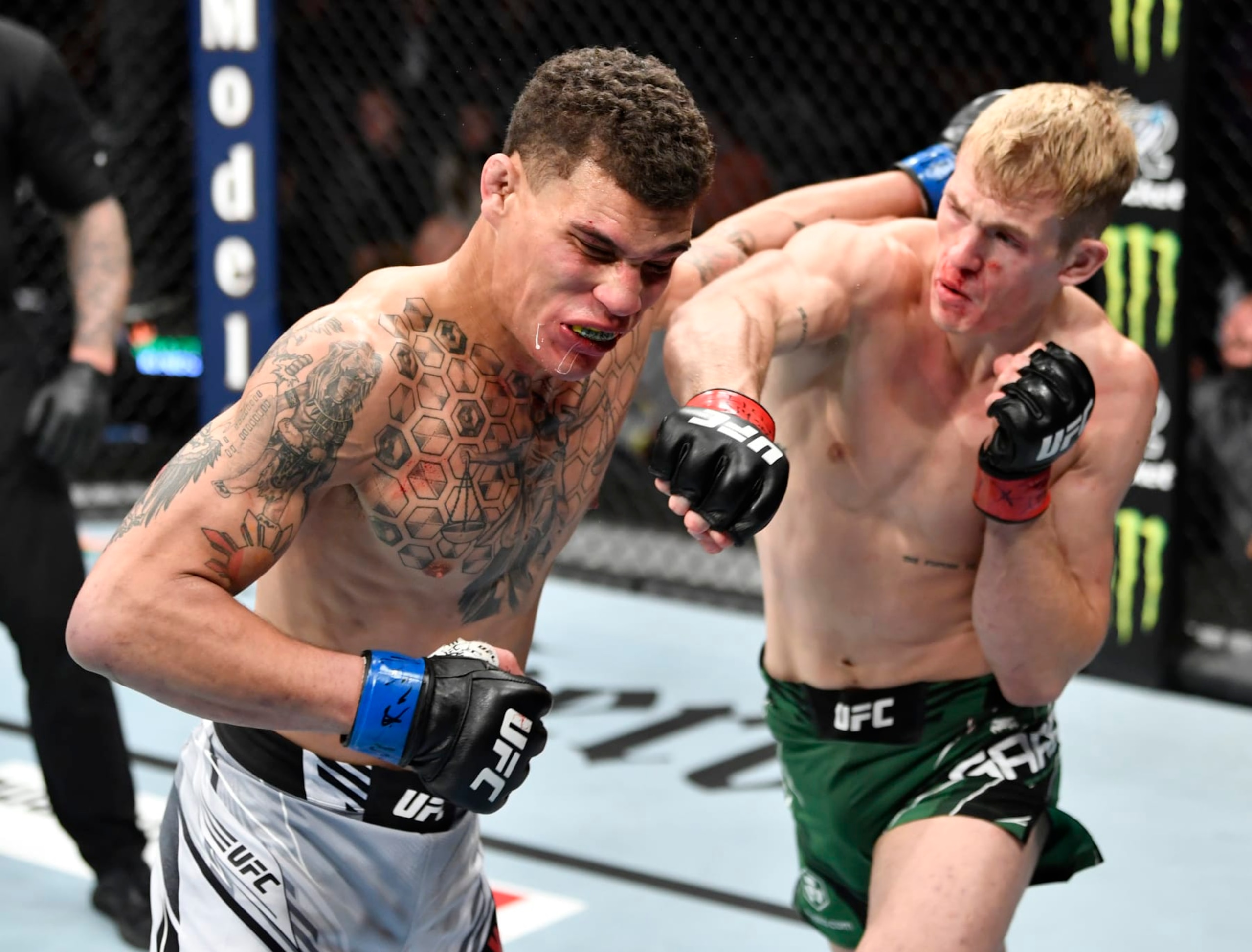 NEW YORK, NEW YORK - NOVEMBER 06: (R-L) Ian Garry of Ireland punches Jordan Williams in their welterweight fight during the UFC 268 event at Madison Square Garden on November 06, 2021 in New York City. (Photo by Jeff Bottari/Zuffa LLC)