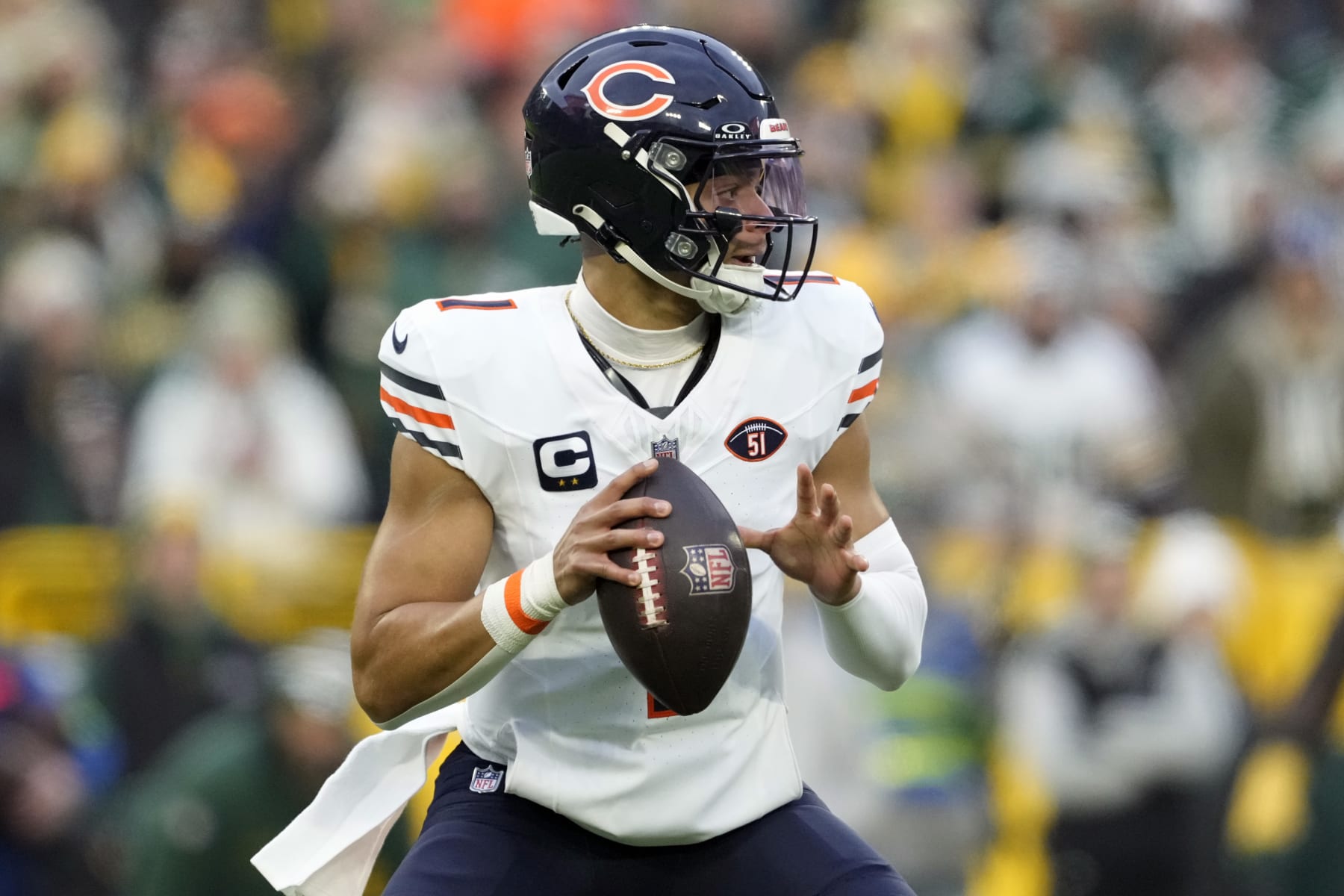 GREEN BAY, WISCONSIN - JANUARY 07: Justin Fields #1 of the Chicago Bears looks to throw a pass during the first quarter in the game against the Green Bay Packers at Lambeau Field on January 07, 2024 in Green Bay, Wisconsin. (Photo by Patrick McDermott/Getty Images)