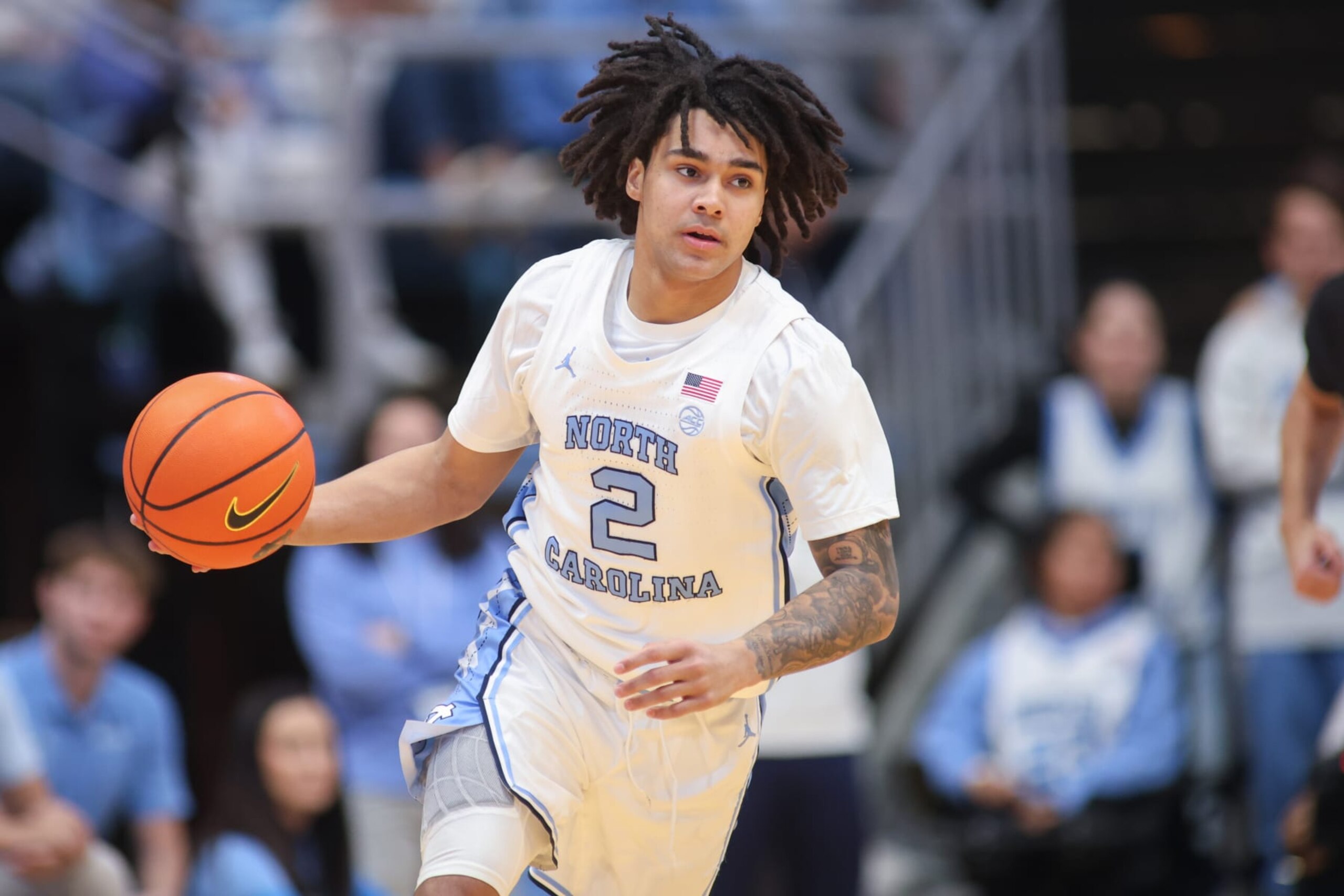 CHAPEL HILL, NC - FEBRUARY 17: North Carolina Tar Heels guard Elliot Cadeau (2) brings the ball up court during the college basketball game between the North Carolina Tar Heels and the Virginia Tech Hokies on February 17, 2024 at the Dean Smith Center in Chapel Hill, NC. (Photo by Nicholas Faulkner/Icon Sportswire via Getty Images) CHAPEL HILL, NC - FEBRUARY 17: North Carolina Tar Heels guard Elliot Cadeau (2) brings the ball up court during the college basketball game between the North Carolina Tar Heels and the Virginia Tech Hokies on February 17, 2024 at the Dean Smith Center in Chapel Hill, NC. (Photo by Nicholas Faulkner/Icon Sportswire via Getty Images)