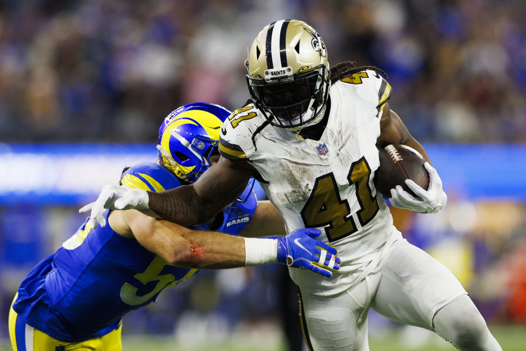 INGLEWOOD, CALIFORNIA - DECEMBER 21: Alvin Kamara #41 of the New Orleans Saints runs with the ball during a game against the Los Angeles Rams at SoFi Stadium on December 21, 2023 in Inglewood, California. (Photo by Ric Tapia/Getty Images)