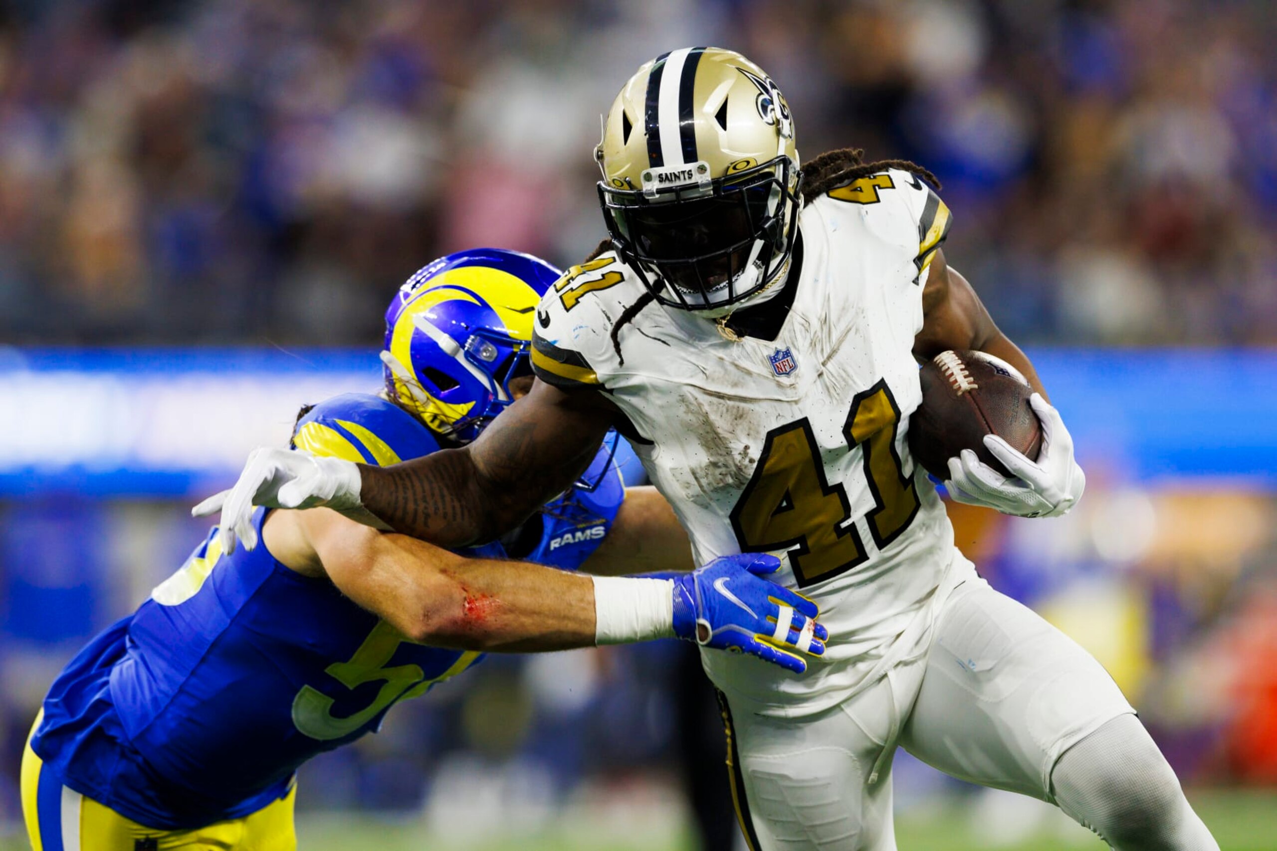 INGLEWOOD, CALIFORNIA - DECEMBER 21: Alvin Kamara #41 of the New Orleans Saints runs with the ball during a game against the Los Angeles Rams at SoFi Stadium on December 21, 2023 in Inglewood, California. (Photo by Ric Tapia/Getty Images)