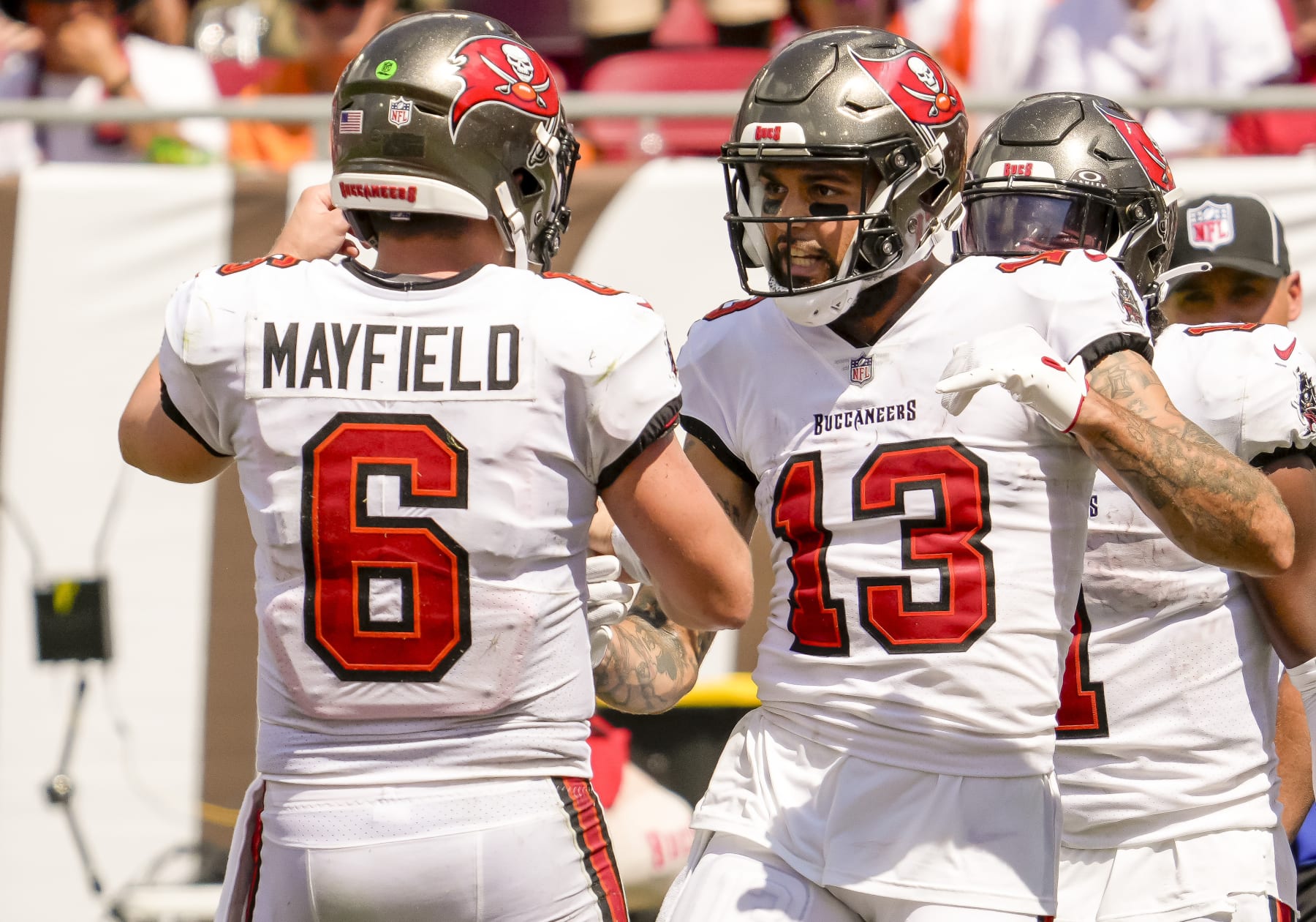 TAMPA, FL - SEPTEMBER 17: Tampa Bay Buccaneers wide receiver Mike Evans (13) scores a touchdown and celebrates with Tampa Bay Buccaneers quarterback Baker Mayfield (6)  during the NFL Football match between the Tampa Bay Buccaneers and Chicago Bears on September 17, 2023 at TIAA Bank Field Stadium, FL. (Photo by Andrew Bershaw/Icon Sportswire via Getty Images)