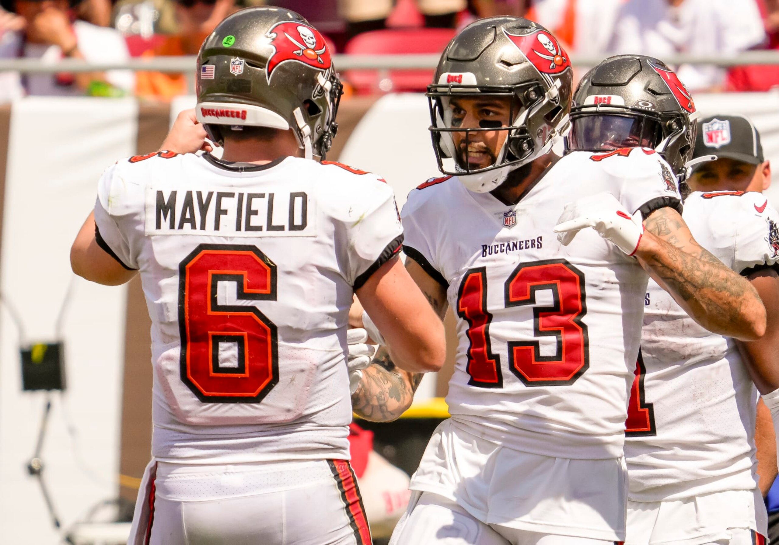TAMPA, FL - SEPTEMBER 17: Tampa Bay Buccaneers wide receiver Mike Evans (13) scores a touchdown and celebrates with Tampa Bay Buccaneers quarterback Baker Mayfield (6)  during the NFL Football match between the Tampa Bay Buccaneers and Chicago Bears on September 17, 2023 at TIAA Bank Field Stadium, FL. (Photo by Andrew Bershaw/Icon Sportswire via Getty Images)