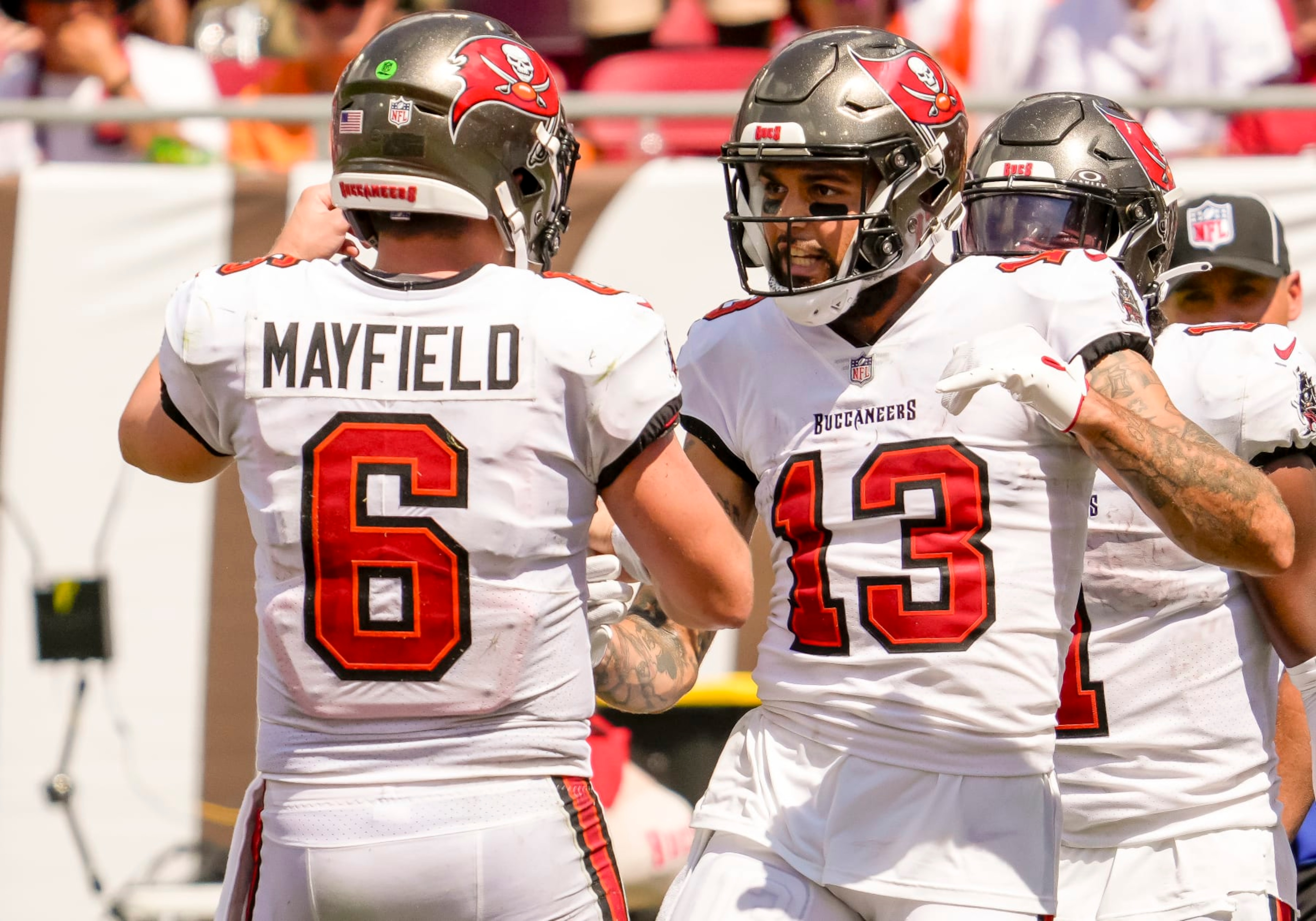 TAMPA, FL - SEPTEMBER 17: Tampa Bay Buccaneers wide receiver Mike Evans (13) scores a touchdown and celebrates with Tampa Bay Buccaneers quarterback Baker Mayfield (6)  during the NFL Football match between the Tampa Bay Buccaneers and Chicago Bears on September 17, 2023 at TIAA Bank Field Stadium, FL. (Photo by Andrew Bershaw/Icon Sportswire via Getty Images)