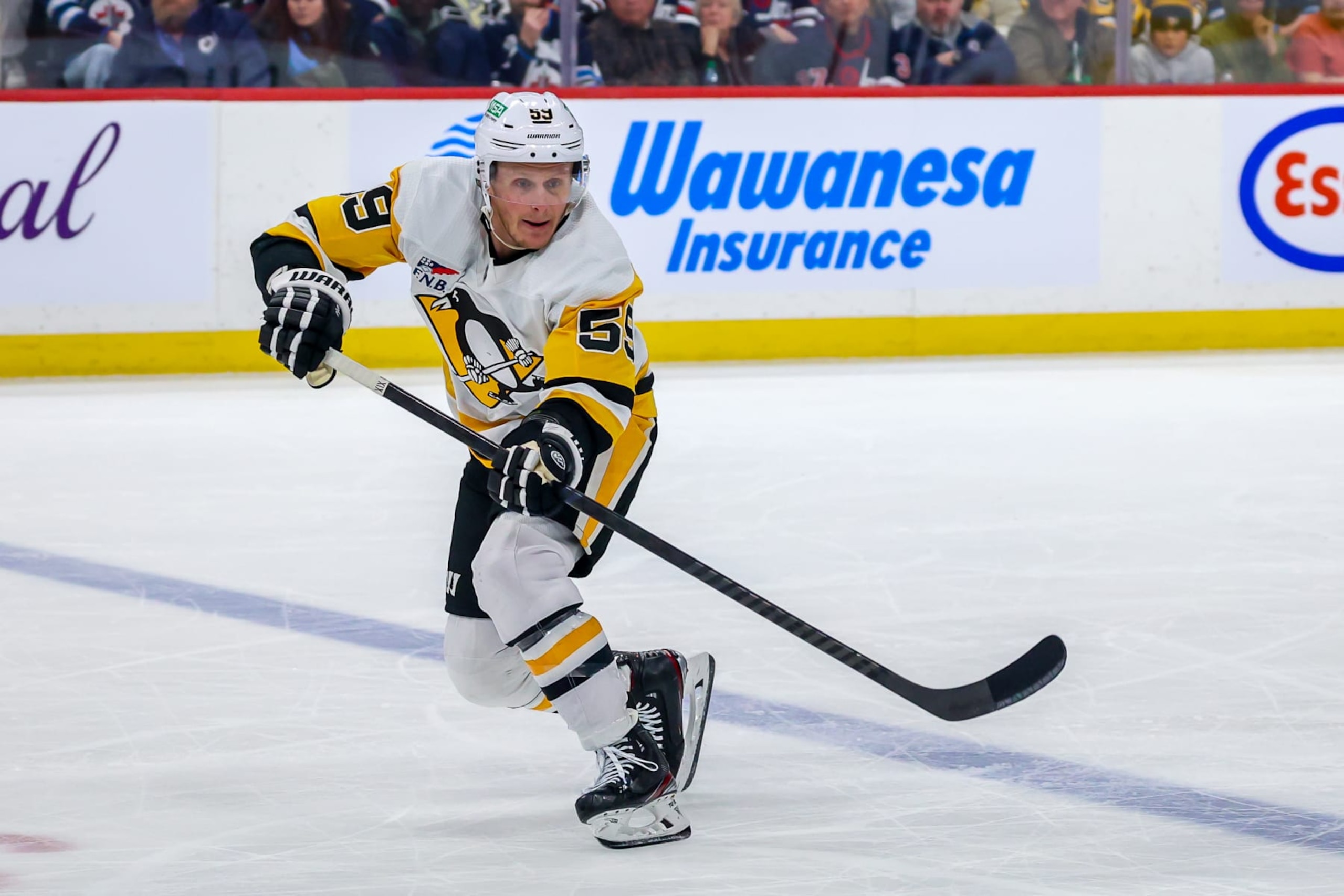 WINNIPEG, CANADA - FEBRUARY 10: Jake Guentzel #59 of the Pittsburgh Penguins skates during third period action against the Winnipeg Jets at Canada Life Centre on February 10, 2024 in Winnipeg, Manitoba, Canada. (Photo by Jonathan Kozub/NHLI via Getty Images)