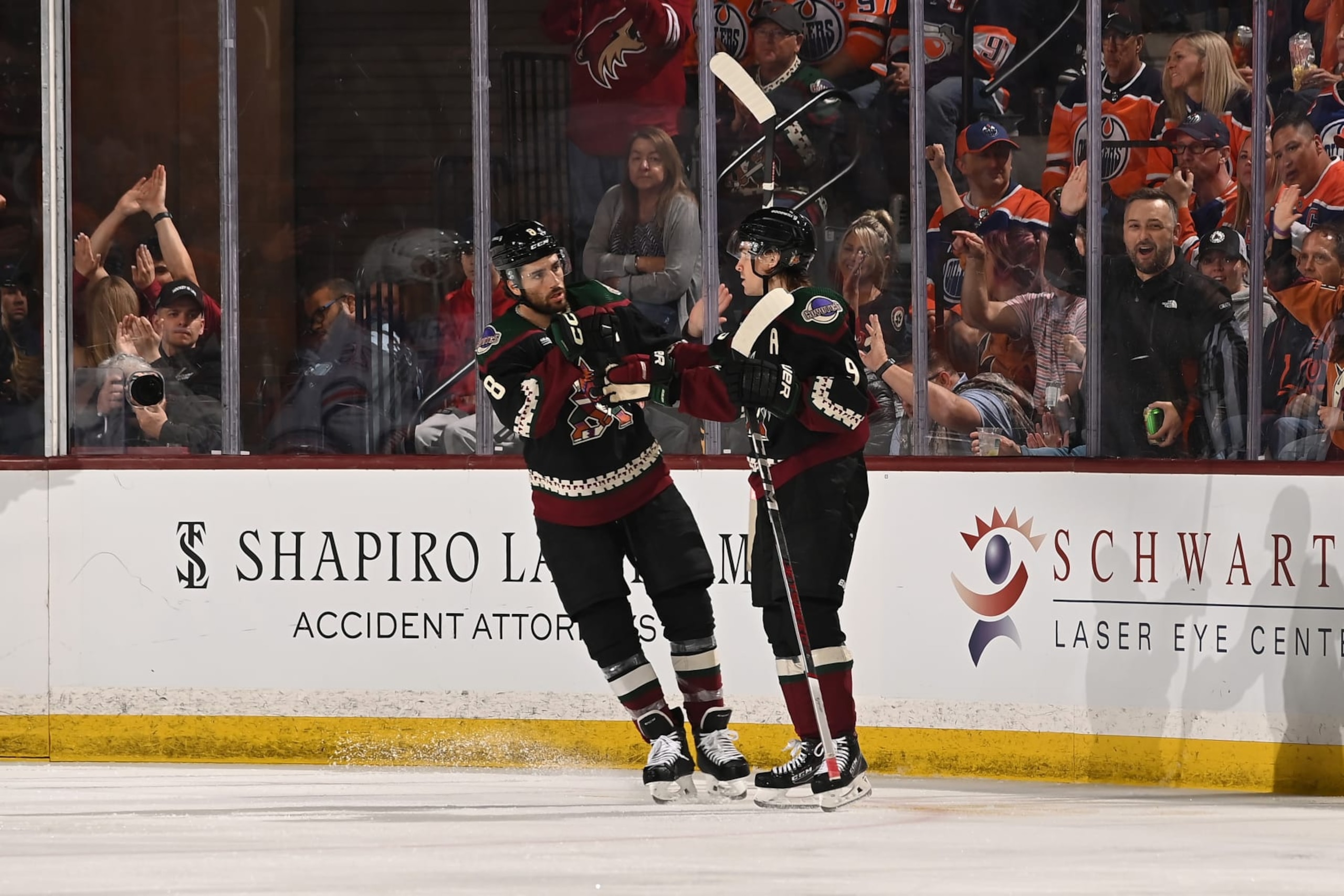 TEMPE, ARIZONA - FEBRUARY 19: Clayton Keller #9 of the Arizona Coyotes celebrates with teammate Nick Schmaltz #8 after scoring a goal against the Edmonton Oilers during the second period of the game at Mullett Arena on February 19, 2024 in Tempe, Arizona. (Photo by Norm Hall/NHLI via Getty Images)