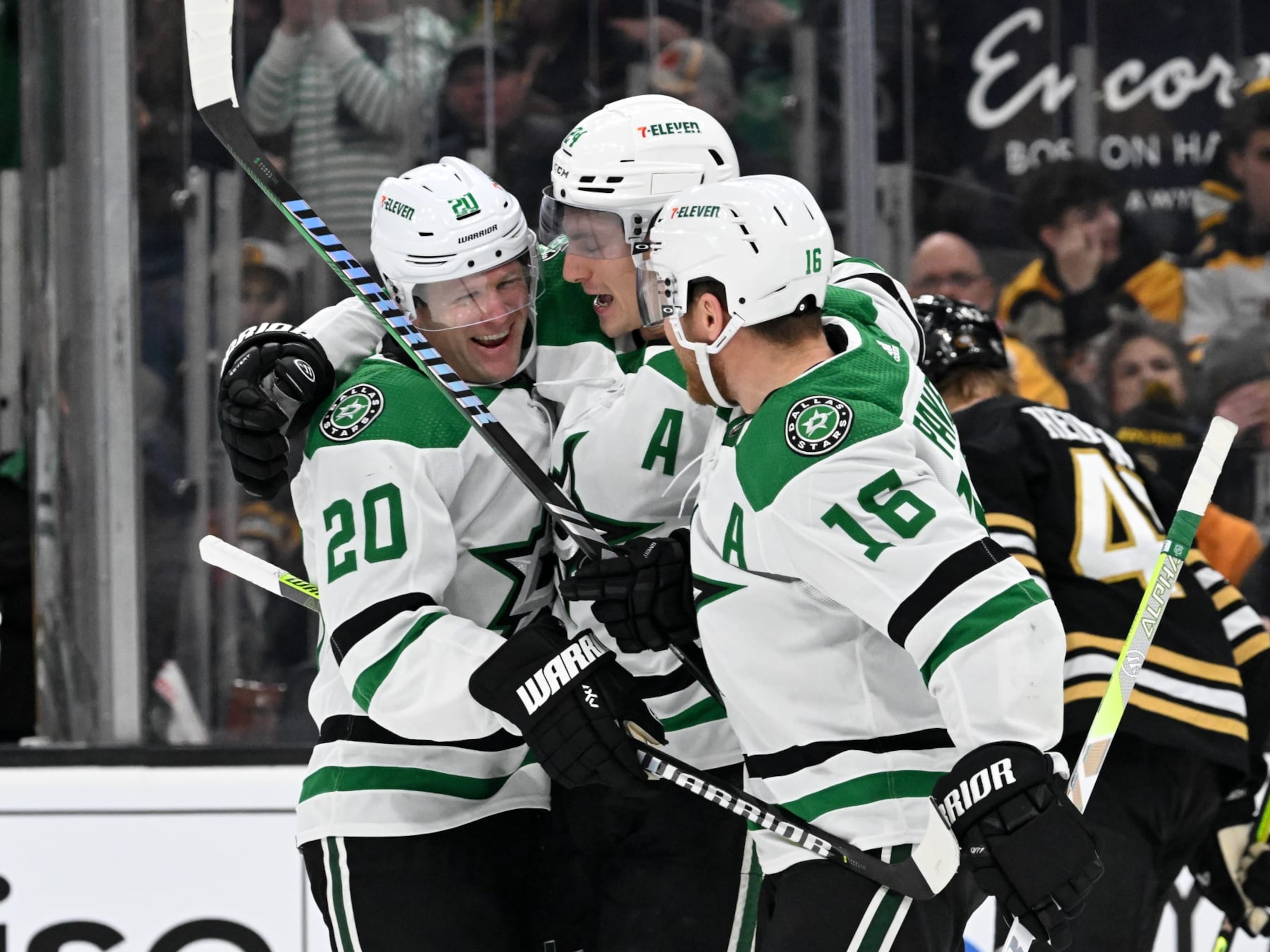 BOSTON, MASSACHUSETTS - FEBRUARY 19: Ryan Suter #20 of the Dallas Stars celebrates with Roope Hintz #24 and Joe Pavelski #16 after scoring a goal against the Boston Bruins during the second period at the TD Garden on February 19, 2024 in Boston, Massachusetts. (Photo by Brian Fluharty/Getty Images)
