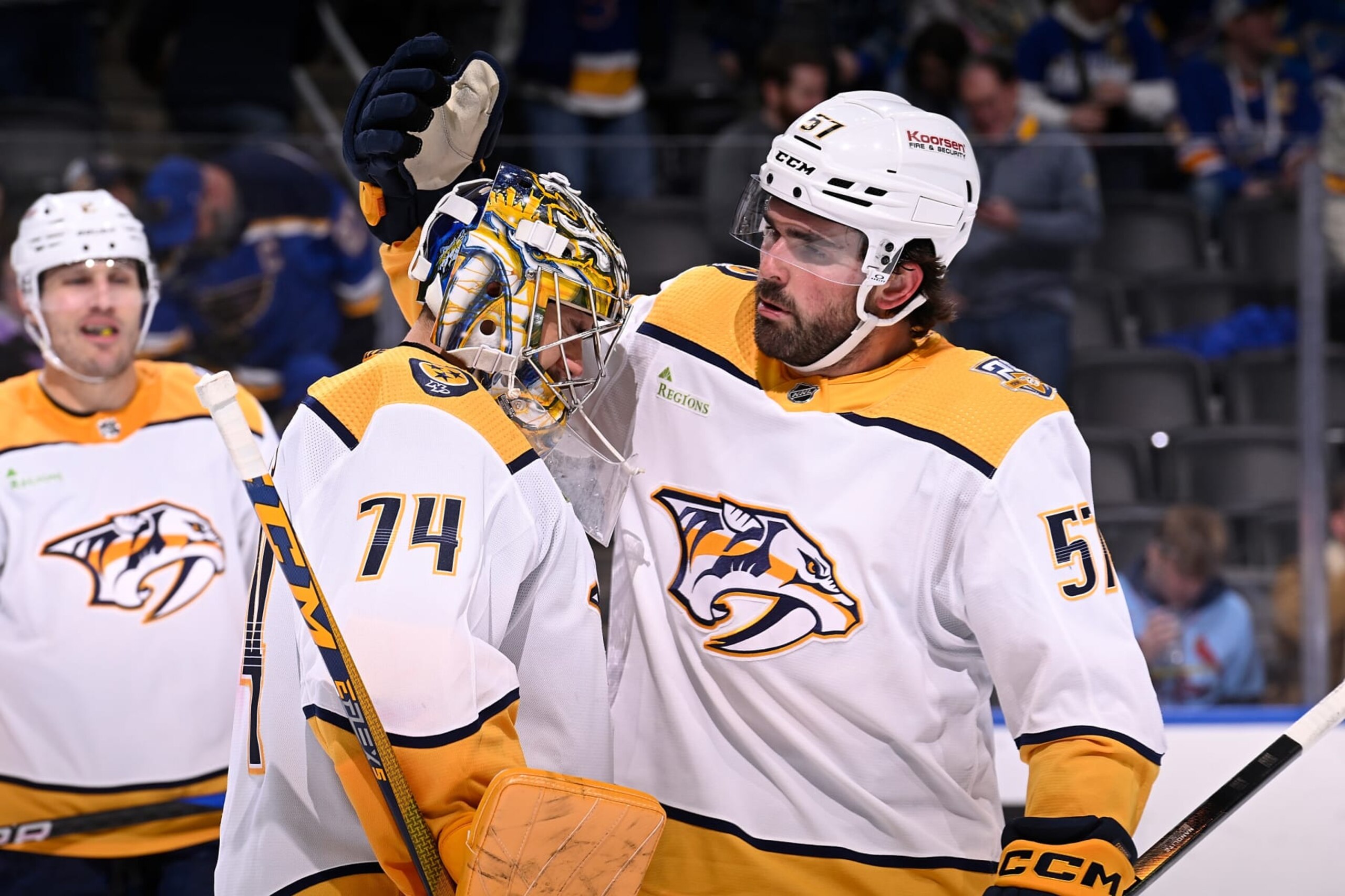 ST. LOUIS, MO - FEBRUARY 17: Juuse Saros #74 and Dante Fabbro #57 of the Nashville Predators celebrate their teams 5-2 victory over the St. Louis Blues on February 17, 2024 at the Enterprise Center in St. Louis, Missouri. (Photo by Joe Puetz/NHLI via Getty Images)