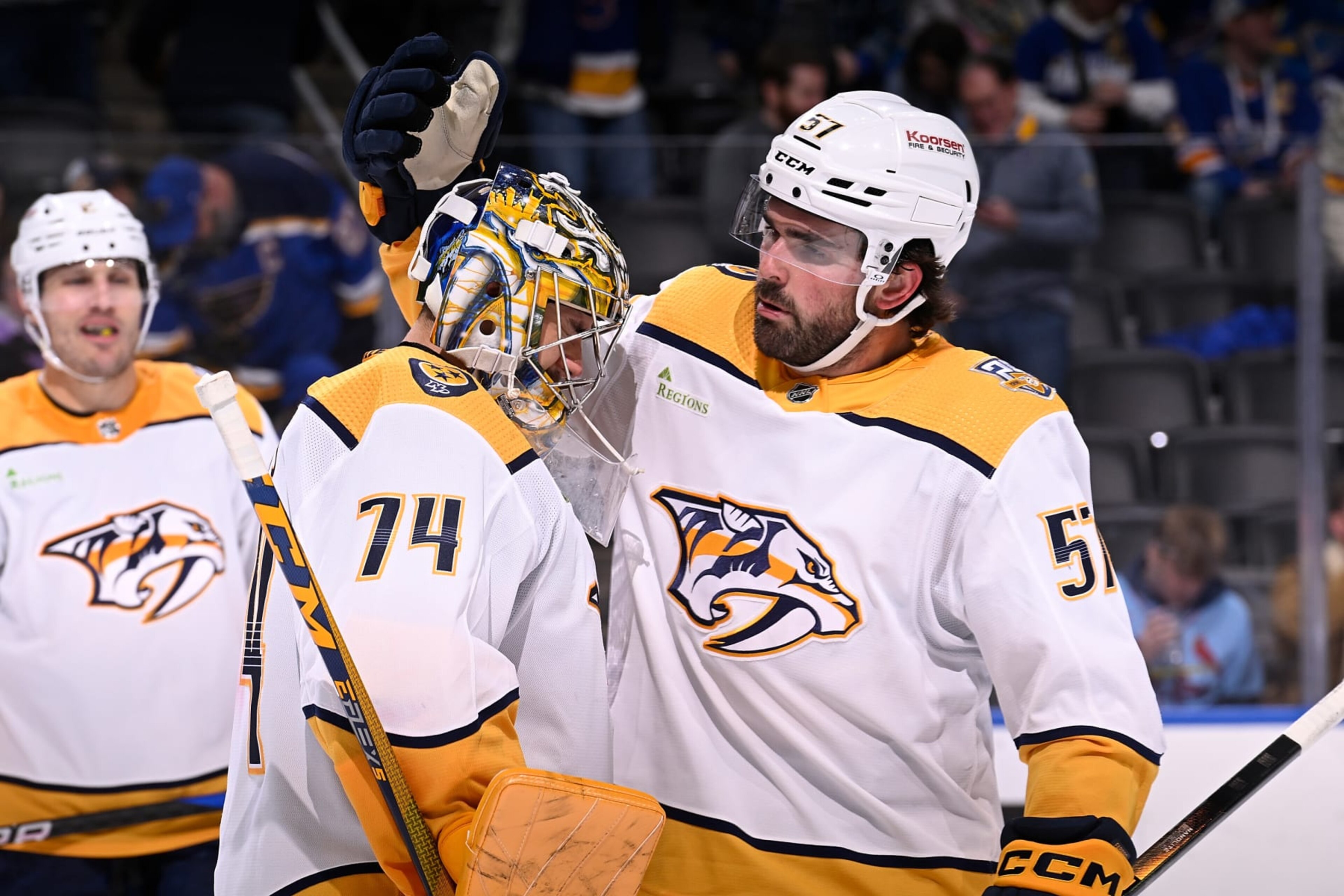 ST. LOUIS, MO - FEBRUARY 17: Juuse Saros #74 and Dante Fabbro #57 of the Nashville Predators celebrate their teams 5-2 victory over the St. Louis Blues on February 17, 2024 at the Enterprise Center in St. Louis, Missouri. (Photo by Joe Puetz/NHLI via Getty Images)