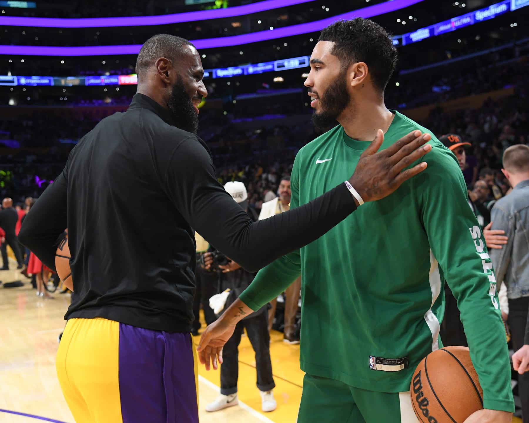 LOS ANGELES, CA - DECEMBER 25:  LeBron James #23 of the Los Angeles Lakers & Jayson Tatum #0 of the Boston Celtics embrace before the game on December 25, 2023 at Crypto.Com Arena in Los Angeles, California. NOTE TO USER: User expressly acknowledges and agrees that, by downloading and/or using this Photograph, user is consenting to the terms and conditions of the Getty Images License Agreement. Mandatory Copyright Notice: Copyright 2023 NBAE (Photo by Juan Ocampo/NBAE via Getty Images)