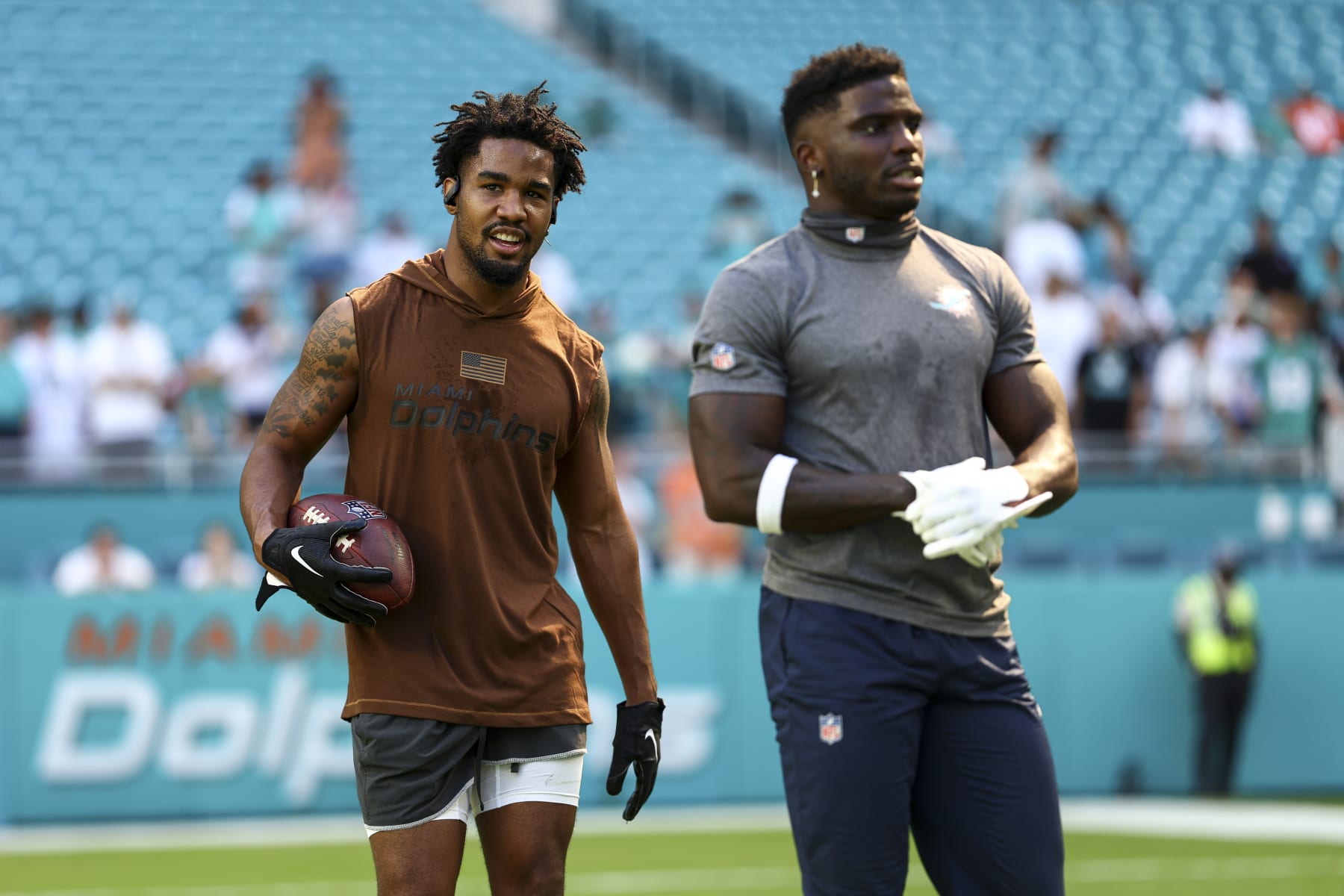 MIAMI GARDENS, FL - NOVEMBER 19: Jaylen Waddle #17 and Tyreek Hill #10 of the Miami Dolphins warm up prior to an NFL football game against the Las Vegas Raiders at Hard Rock Stadium on November 19, 2023 in Miami Gardens, Florida. (Photo by Kevin Sabitus/Getty Images)
