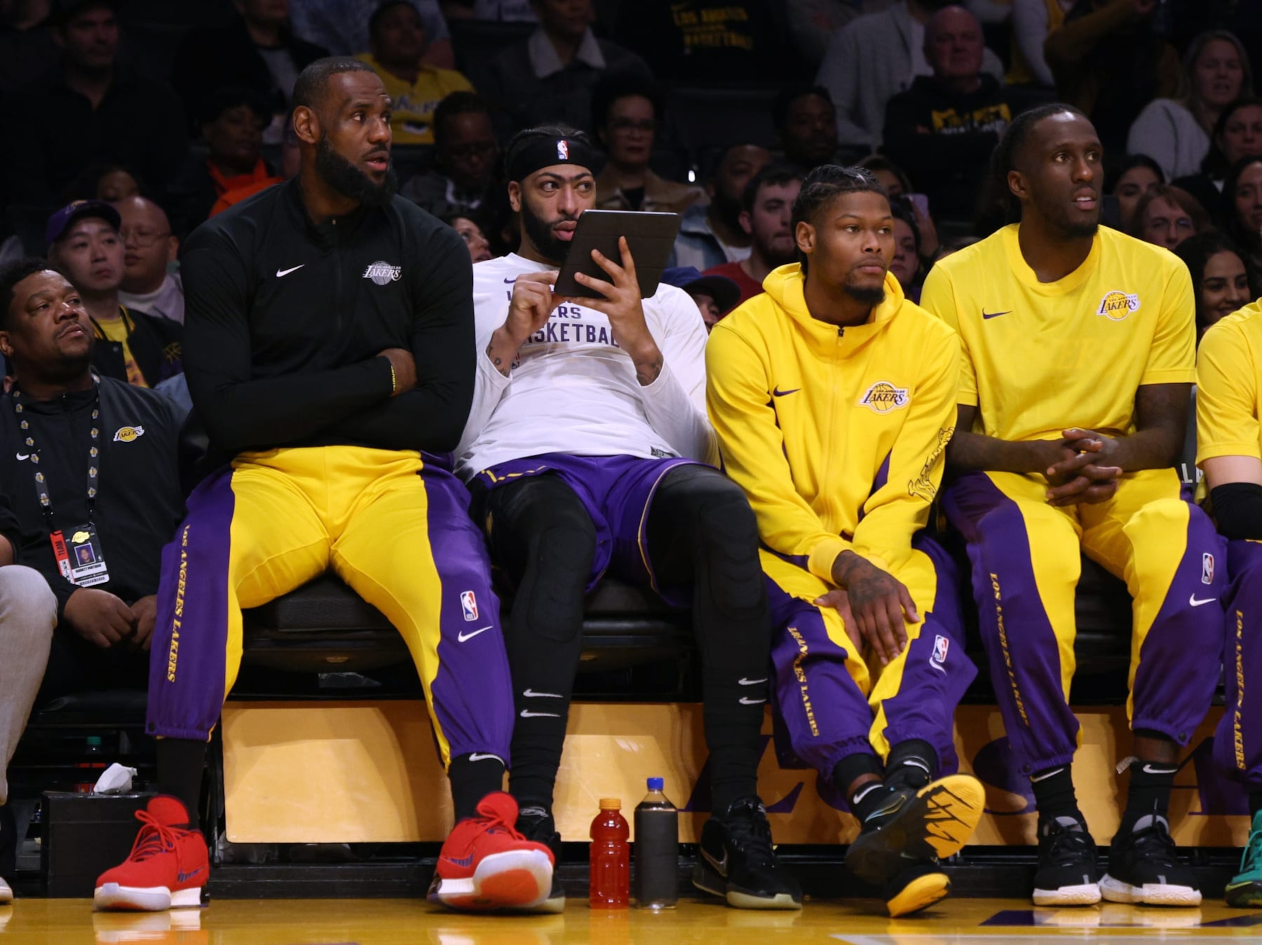 LOS ANGELES, CALIFORNIA - JANUARY 11: (L-R) LeBron James #23, Anthony Davis #3, Cam Reddish #5, and Taurean Prince #12 of the Los Angeles Lakers watch during a 127-109 Phoenix Suns win at Crypto.com Arena on January 11, 2024 in Los Angeles, California. User is consenting to the terms and conditions of the Getty Images License Agreement.  (Photo by Harry How/Getty Images)