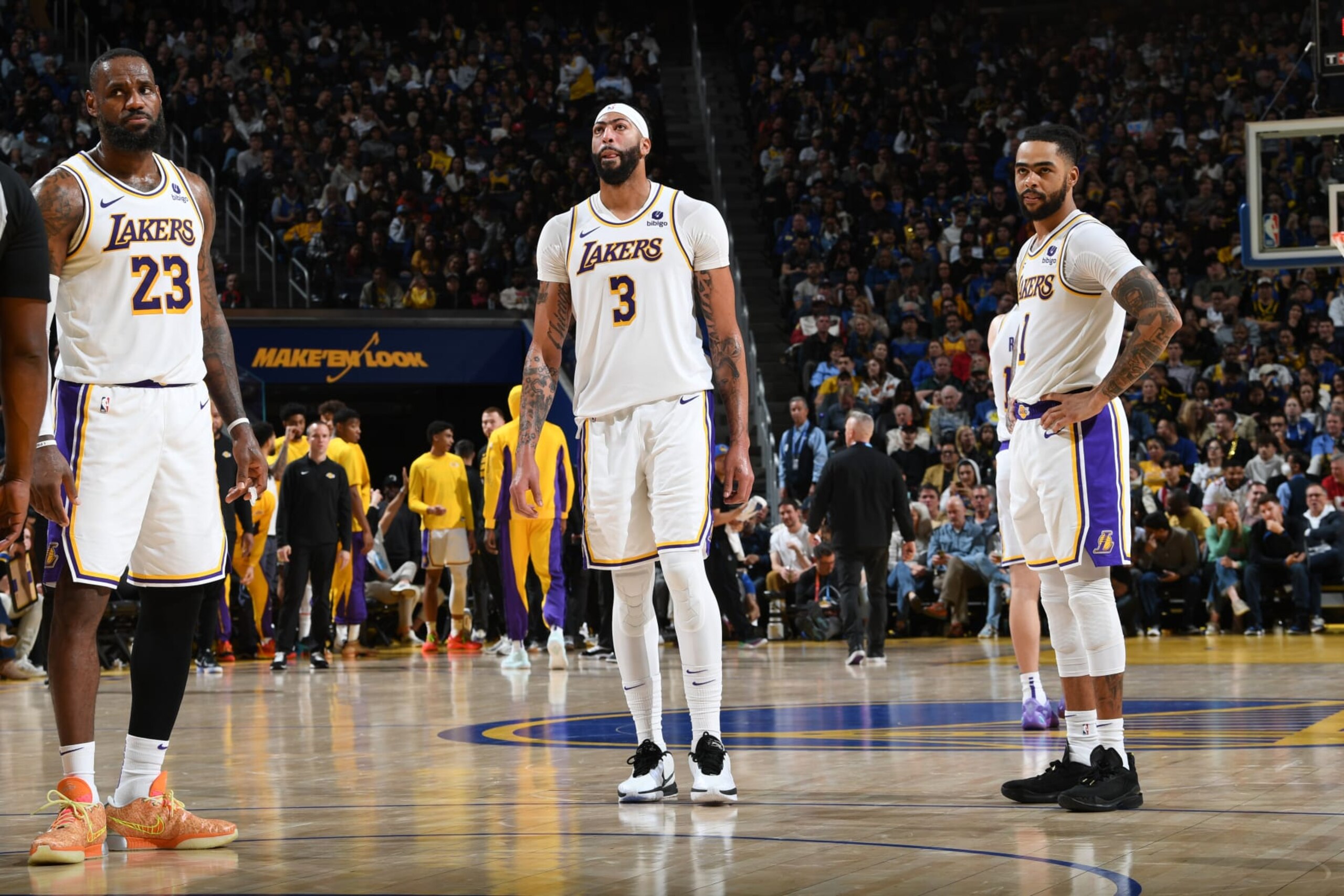 SAN FRANCISCO, CA - JANUARY 27: LeBron James #23, Anthony Davis #3 and D'Angelo Russell #1 of the Los Angeles Lakers look on during the game against the Golden State Warriors on January 27, 2024 at Chase Center in San Francisco, California. NOTE TO USER: User expressly acknowledges and agrees that, by downloading and or using this photograph, user is consenting to the terms and conditions of Getty Images License Agreement. Mandatory Copyright Notice: Copyright 2024 NBAE (Photo by Noah Graham/NBAE via Getty Images)