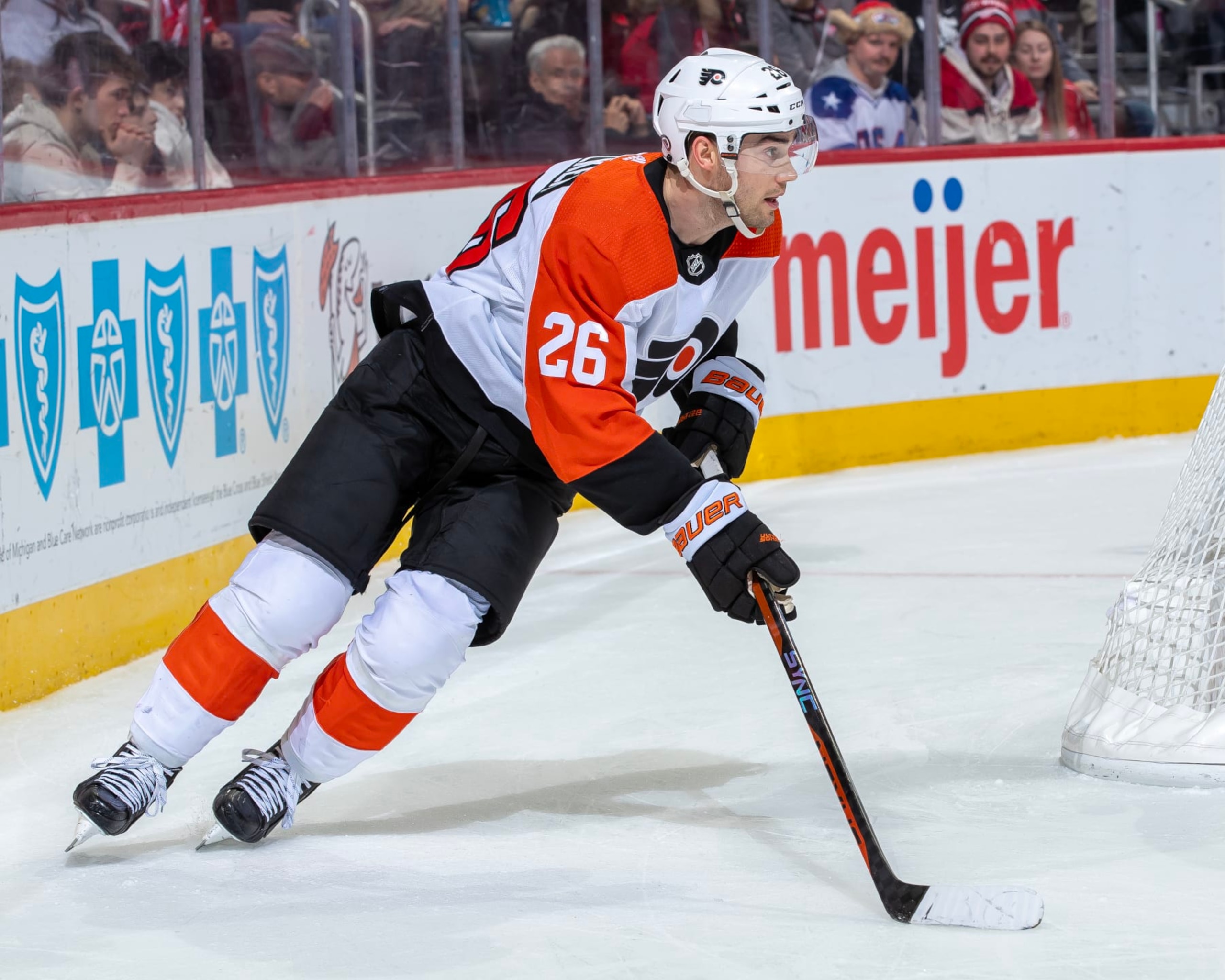 DETROIT, MI - JANUARY 25: Sean Walker #26 of the Philadelphia Flyers skates around the net with the puck against the Detroit Red Wings during the third period at Little Caesars Arena on January 25, 2024 in Detroit, Michigan. Detroit defeated Philadelphia 3-0. (Photo by Dave Reginek/NHLI via Getty Images)