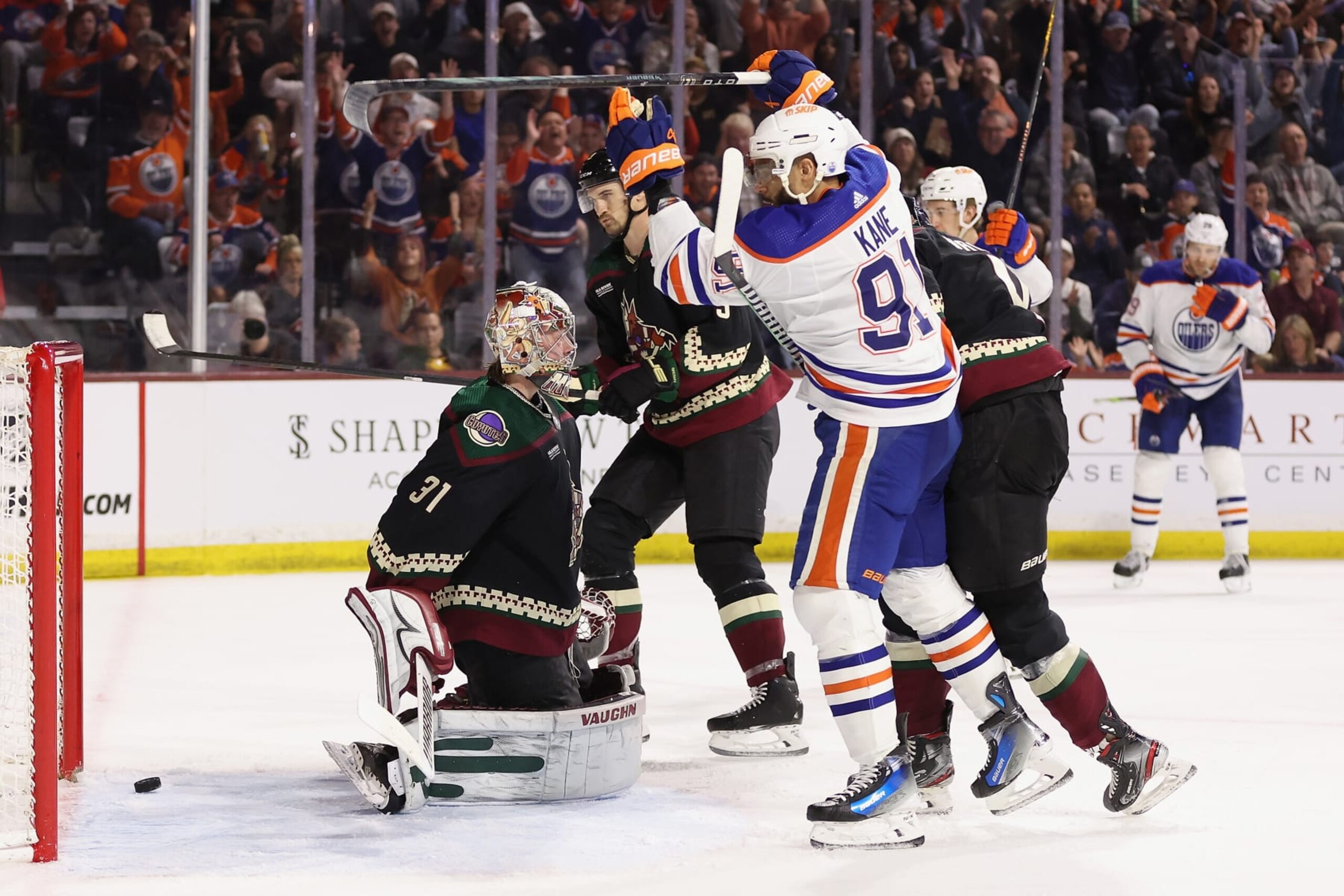TEMPE, ARIZONA - FEBRUARY 19: Evander Kane #91 of the Edmonton Oilers scores a goal past goaltender Matt Villalta #31 of the Arizona Coyotes during the third period of the NHL game at Mullett Arena on February 19, 2024 in Tempe, Arizona. The Oilers defeated the Coyotes 6-3.   (Photo by Christian Petersen/Getty Images)