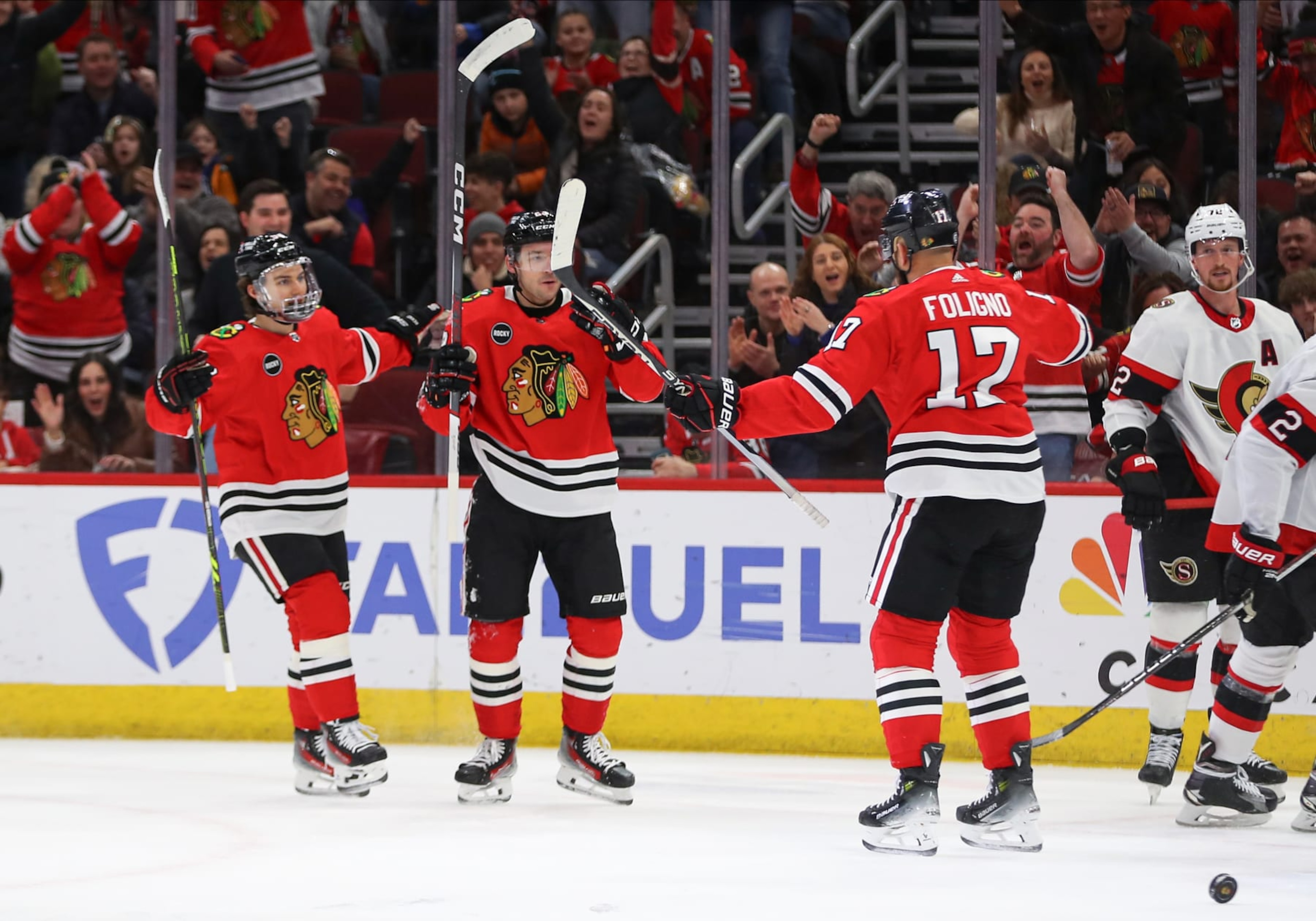CHICAGO, IL - FEBRUARY 17: Connor Bedard #98 of the Chicago Blackhawks Philipp Kurashev #23 of the Chicago Blackhawks celebrate with Nick Foligno #17 of the Chicago Blackhawks after scoring a goal during the first period against the Ottawa Senators at the United Center on February 15, 2024 in Chicago, Illinois. (Photo by Melissa Tamez/Icon Sportswire via Getty Images) CHICAGO, IL - FEBRUARY 17: Connor Bedard #98 of the Chicago Blackhawks Philipp Kurashev #23 of the Chicago Blackhawks celebrate with Nick Foligno #17 of the Chicago Blackhawks after scoring a goal during the first period against the Ottawa Senators at the United Center on February 15, 2024 in Chicago, Illinois. (Photo by Melissa Tamez/Icon Sportswire via Getty Images)