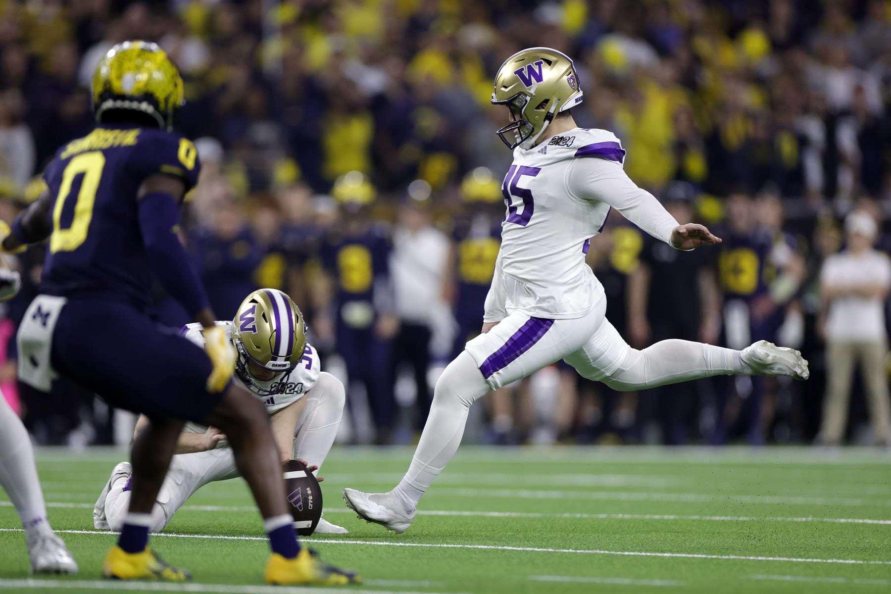HOUSTON, TEXAS - JANUARY 08: Grady Gross #95 of the Washington Huskies kicks a field goal in the third quarter against the Michigan Wolverines during the 2024 CFP National Championship game at NRG Stadium on January 08, 2024 in Houston, Texas. (Photo by Carmen Mandato/Getty Images)
