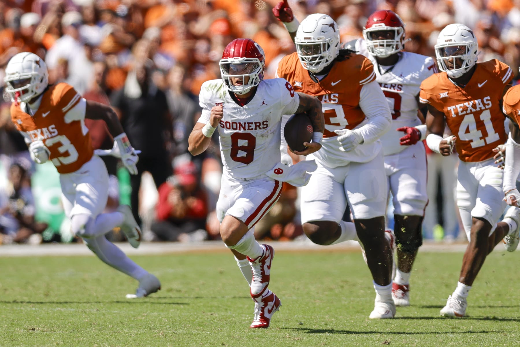 DALLAS, TX - OCTOBER 07: Oklahoma Sooners quarterback Dillon Gabriel (8) runs for a first down during the game between the Texas Longhorns and the Oklahoma Sooners on October 7, 2023 at the Cotton Bowl in Dallas, Texas. (Photo by Matthew Pearce/Icon Sportswire via Getty Images)