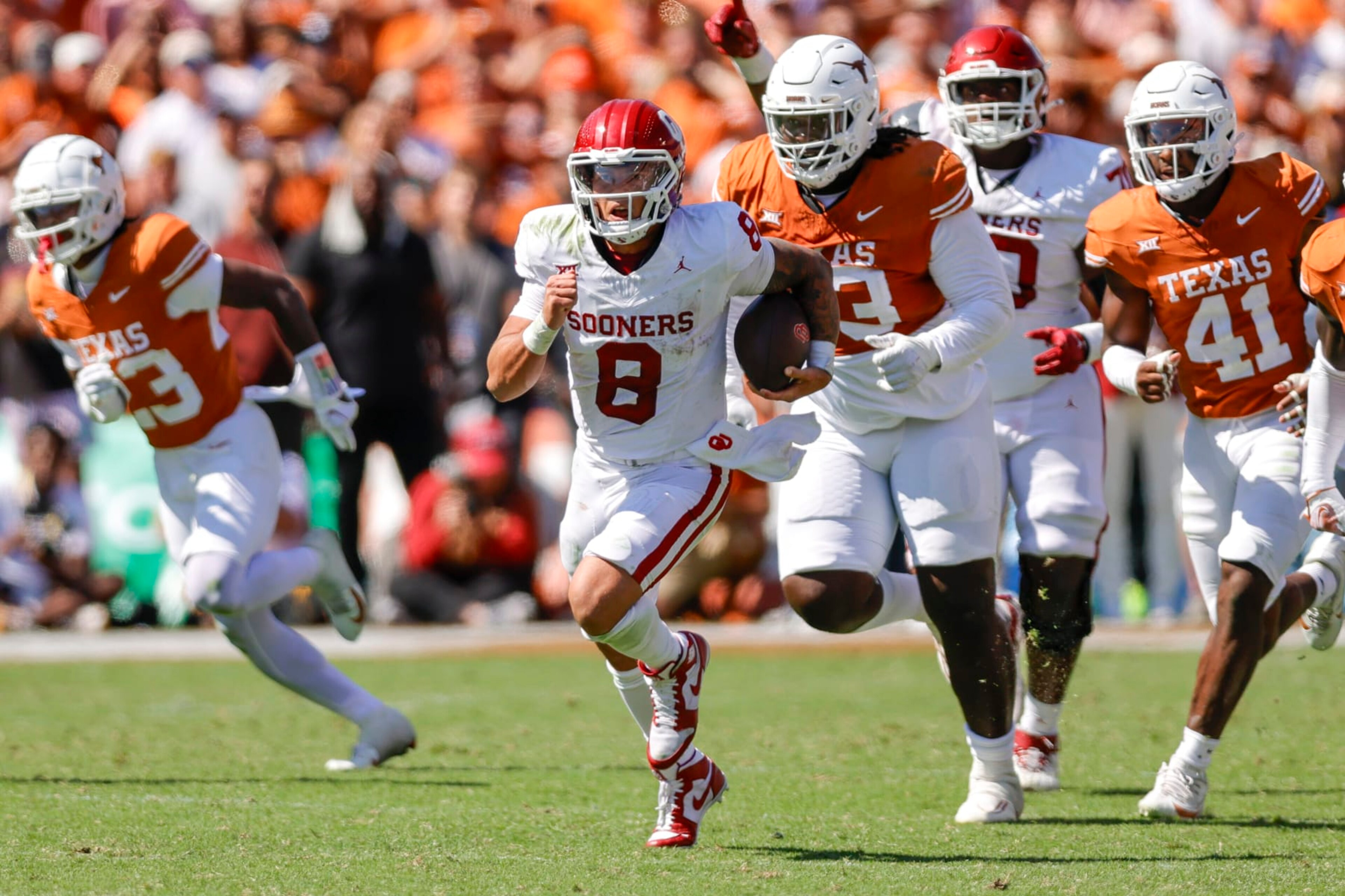DALLAS, TX - OCTOBER 07: Oklahoma Sooners quarterback Dillon Gabriel (8) runs for a first down during the game between the Texas Longhorns and the Oklahoma Sooners on October 7, 2023 at the Cotton Bowl in Dallas, Texas. (Photo by Matthew Pearce/Icon Sportswire via Getty Images)