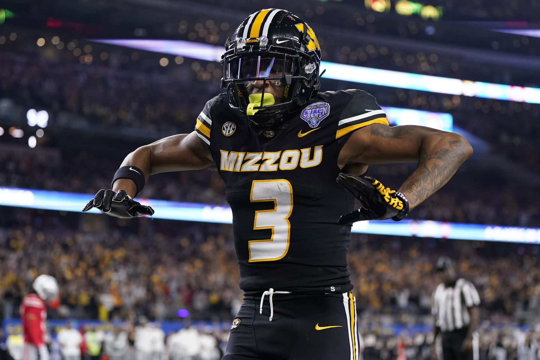 ARLINGTON, TEXAS - DECEMBER 29: Luther Burden III #3 of the Missouri Tigers celebrates after catching a pass for a touchdown during the fourth quarter against the Ohio State Buckeyes in the Goodyear Cotton Bowl at AT&T Stadium on December 29, 2023 in Arlington, Texas. (Photo by Sam Hodde/Getty Images)