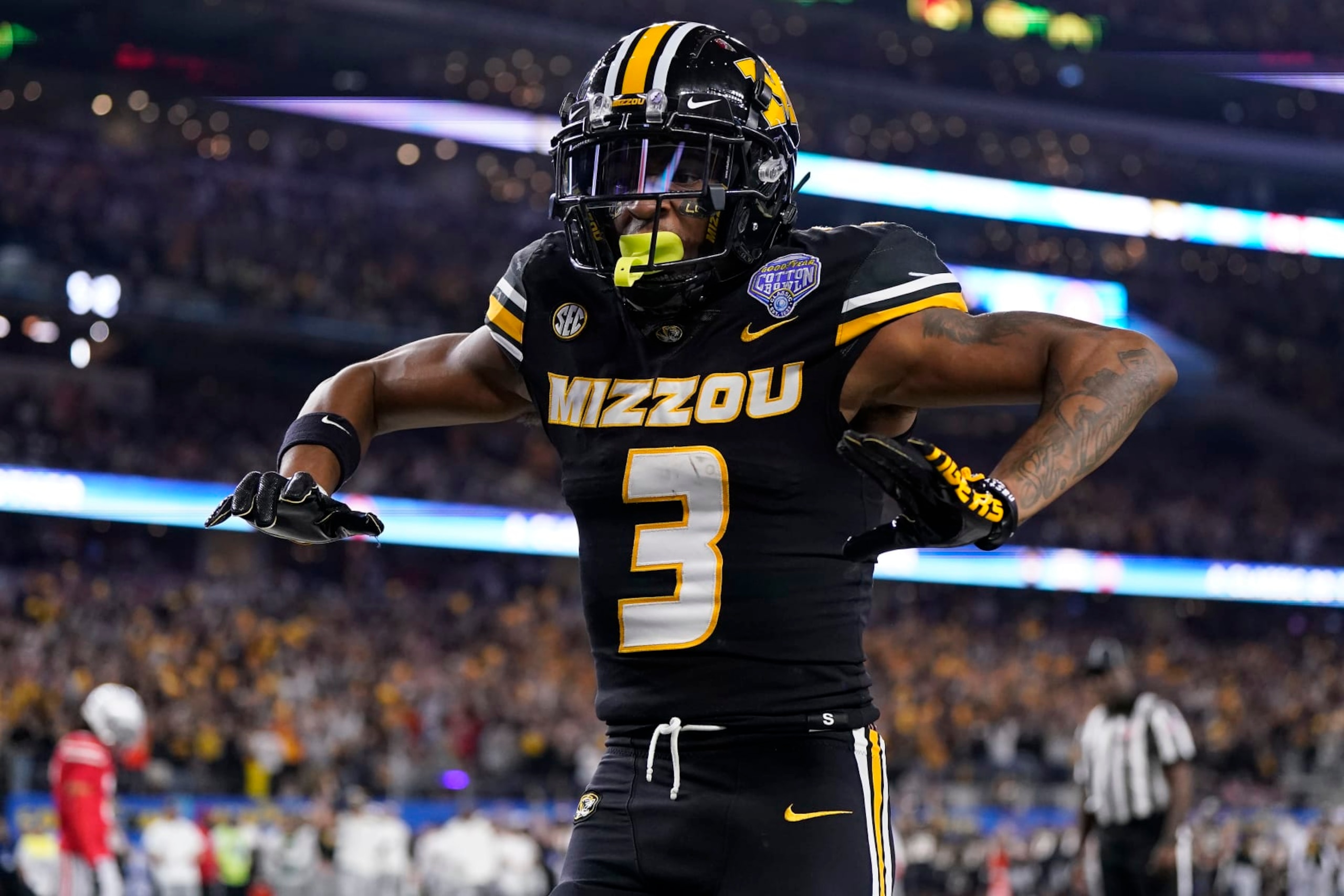 ARLINGTON, TEXAS - DECEMBER 29: Luther Burden III #3 of the Missouri Tigers celebrates after catching a pass for a touchdown during the fourth quarter against the Ohio State Buckeyes in the Goodyear Cotton Bowl at AT&T Stadium on December 29, 2023 in Arlington, Texas. (Photo by Sam Hodde/Getty Images)