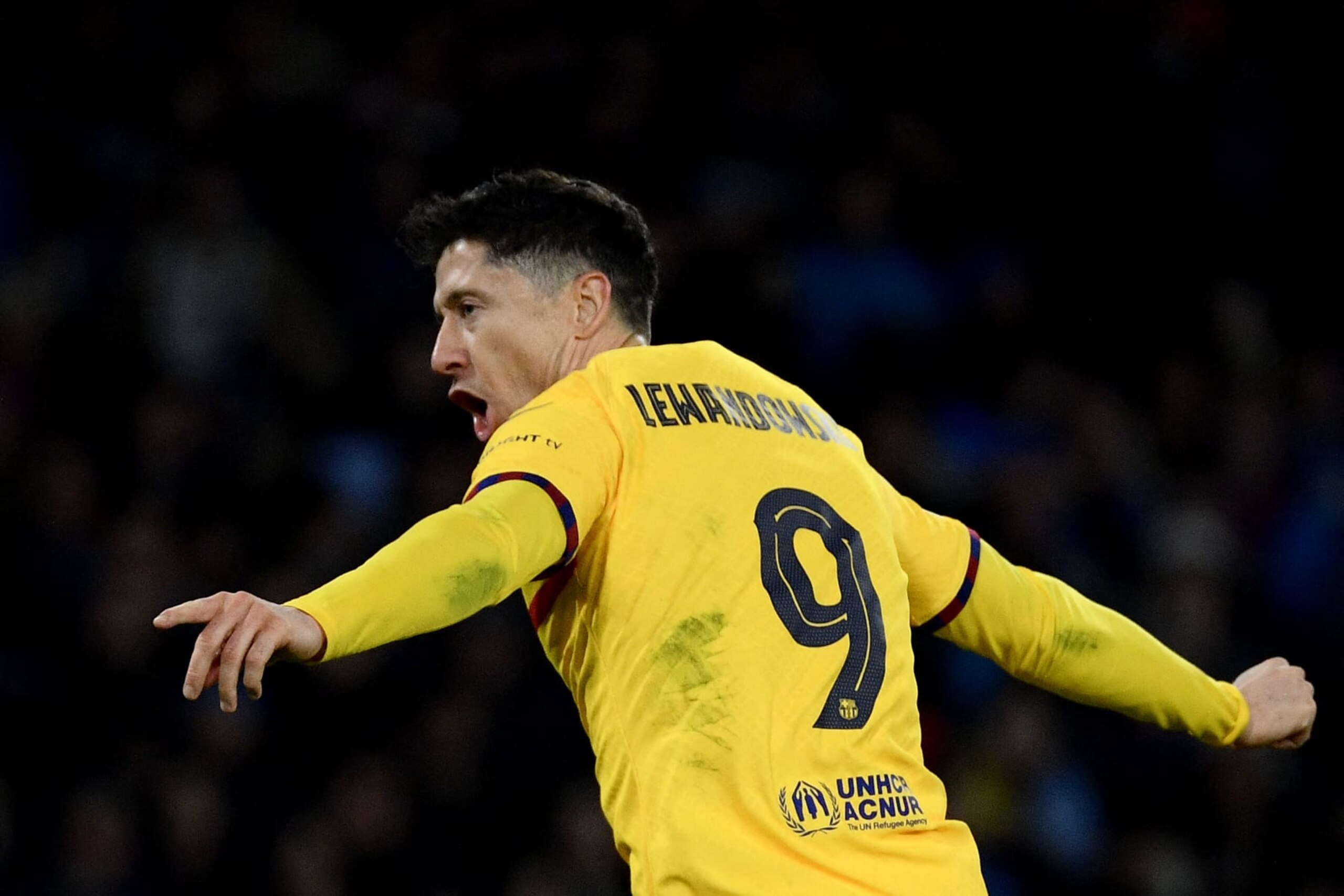Barcelona's Polish forward #09 Robert Lewandowski celebrates after scoring a goal during the UEFA Champions League round of 16 first Leg football match between Napoli and Barcelona at the Diego-Armando-Maradona stadium in Naples on February 21, 2024. (Photo by Filippo MONTEFORTE / AFP) (Photo by FILIPPO MONTEFORTE/AFP via Getty Images)