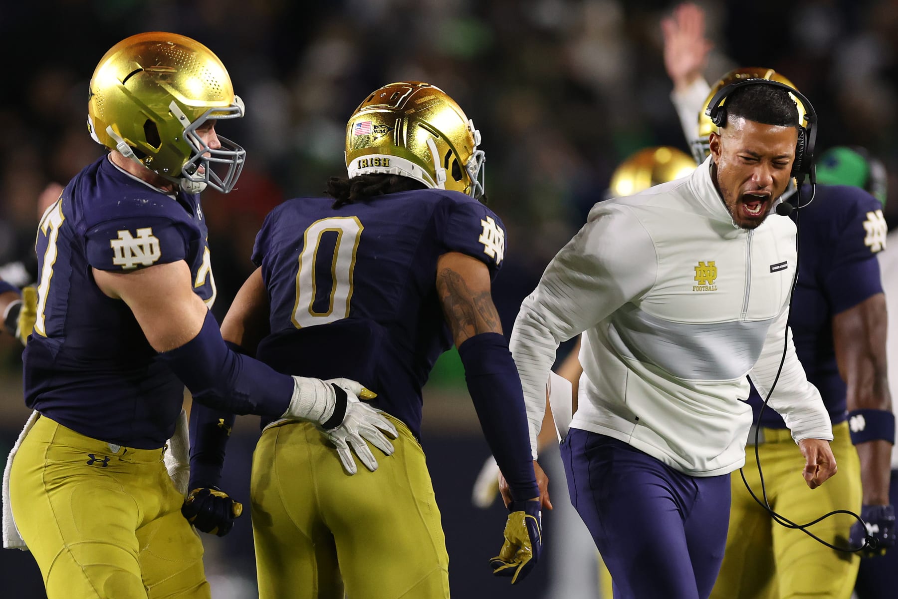 SOUTH BEND, INDIANA - OCTOBER 14: Head coach Marcus Freeman of the Notre Dame Fighting Irish celebrates a fumble with Xavier Watts #0 against the USC Trojans during the second half at Notre Dame Stadium on October 14, 2023 in South Bend, Indiana. (Photo by Michael Reaves/Getty Images)