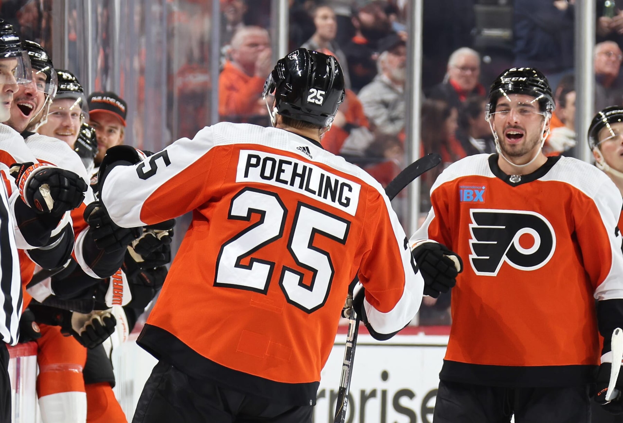 PHILADELPHIA, PENNSYLVANIA - FEBRUARY 10:  Ryan Poehling #25 of the Philadelphia Flyers celebrates his first period shorthanded goal with teammates on the bench against the Seattle Kraken at the Wells Fargo Center on February 10, 2024 in Philadelphia, Pennsylvania.  (Photo by Len Redkoles/NHLI via Getty Images)