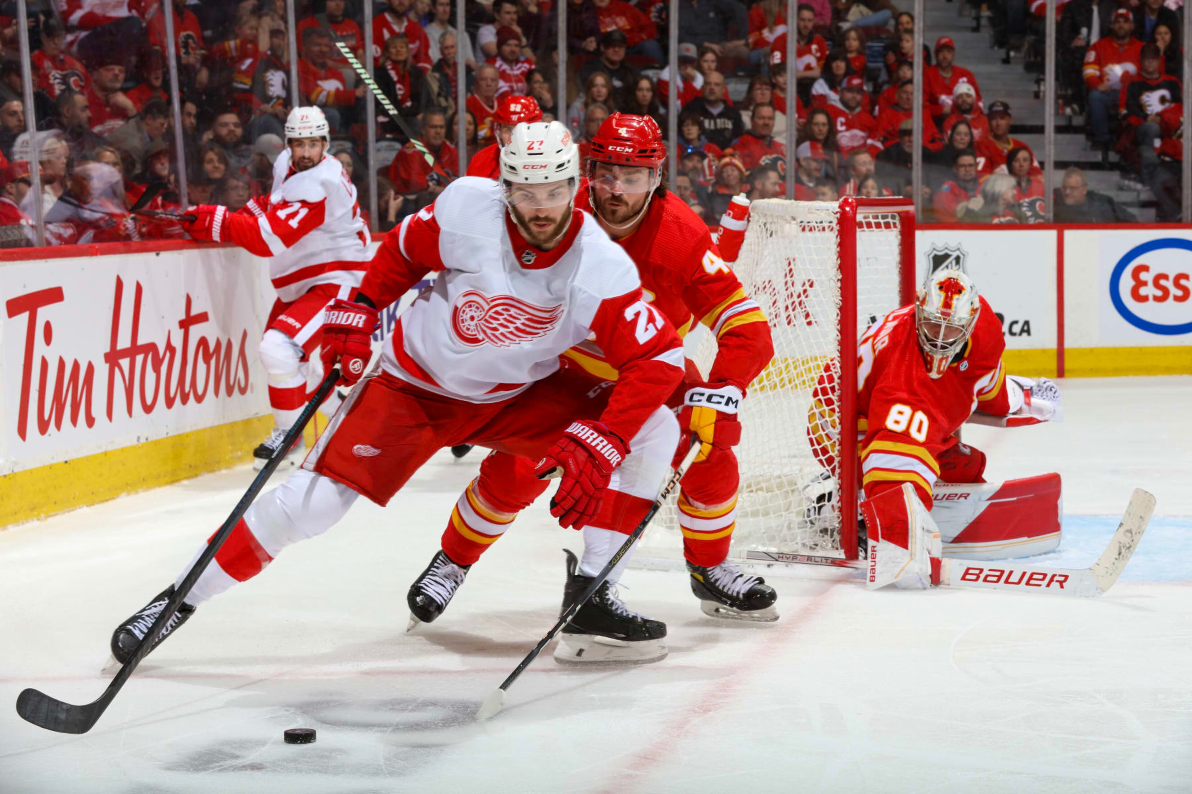CALGARY, ALBERTA - FEBRUARY 17: Michael Rasmussen #27 of the Detroit Red Wings skates against Rasmus Andersson #4 of the Calgary Flames at the Scotiabank Saddledome on February 17, 2024 in Calgary, Alberta. (Photo by Gerry Thomas/NHLI via Getty Images) CALGARY, ALBERTA - FEBRUARY 17: Michael Rasmussen #27 of the Detroit Red Wings skates against Rasmus Andersson #4 of the Calgary Flames at the Scotiabank Saddledome on February 17, 2024 in Calgary, Alberta. (Photo by Gerry Thomas/NHLI via Getty Images)
