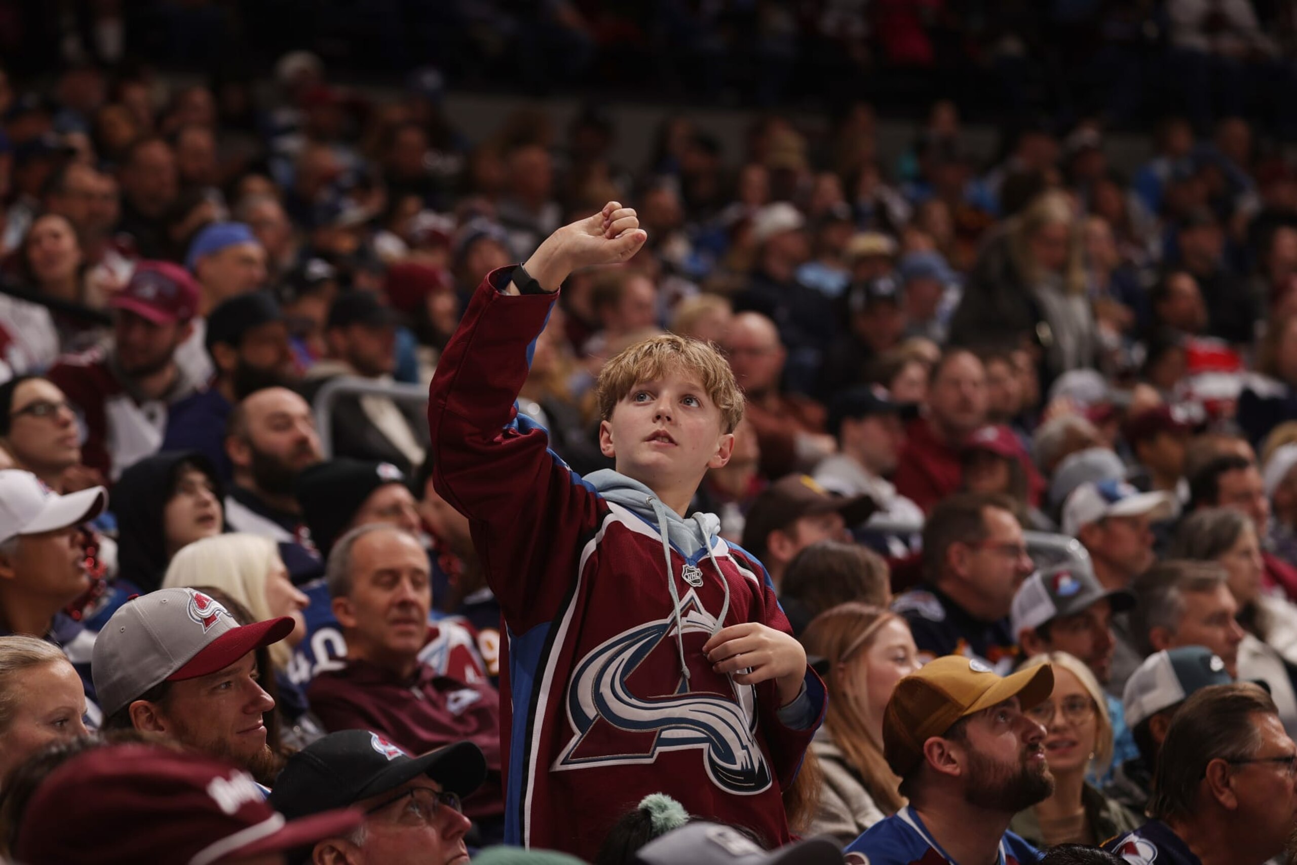 DENVER, COLORADO - FEBRUARY 20: A young of the Colorado Avalanche cheers against the Vancouver Canucks at Ball Arena on February 20, 2024 in Denver, Colorado. (Photo by Michael Martin/NHLI via Getty Images)