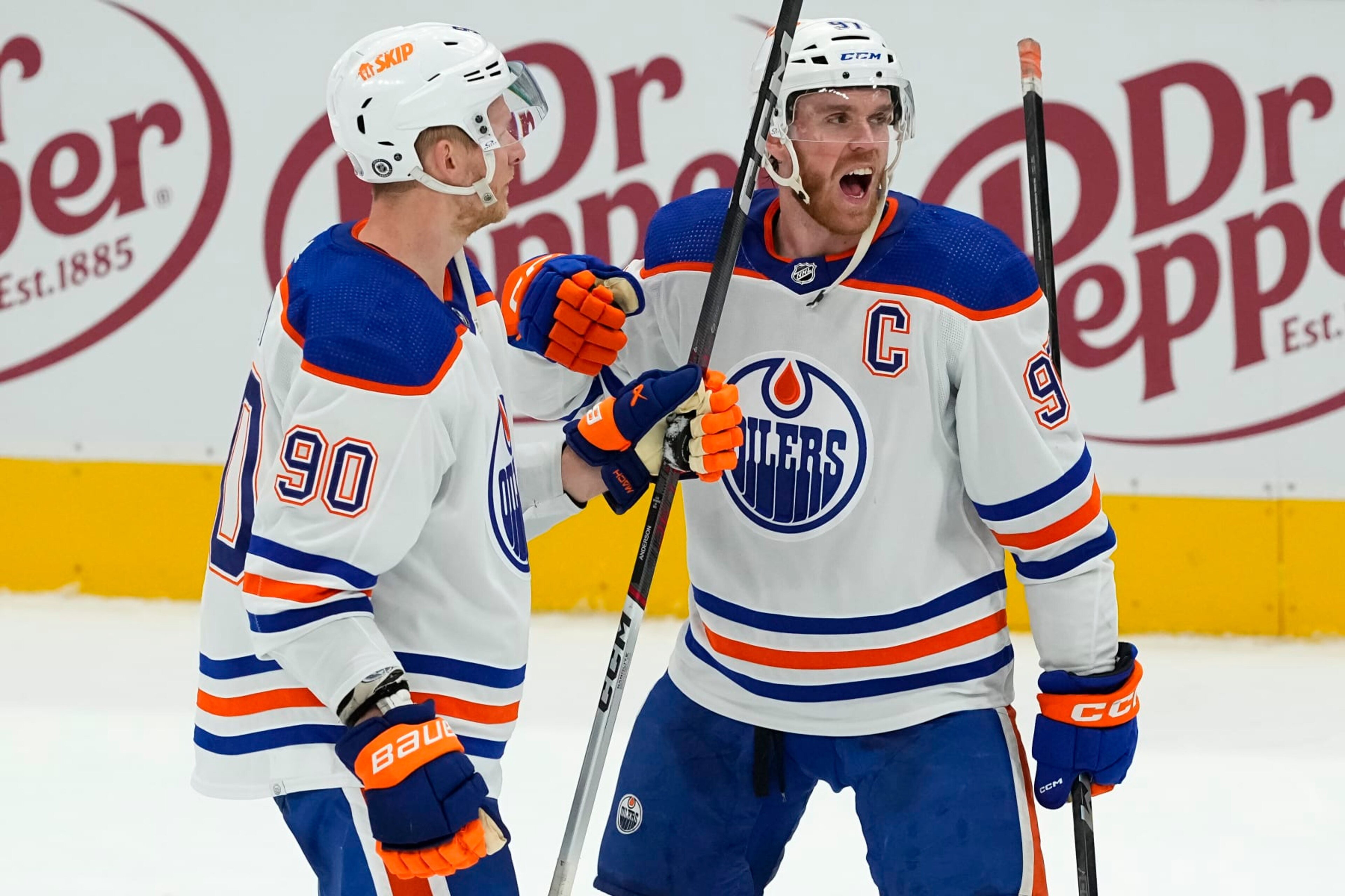 DALLAS, TEXAS - FEBRUARY 17: Connor McDavid #97 of the Edmonton Oilers celebrates with Corey Perry #90 after defeating the Dallas Stars in overtime at American Airlines Center on February 17, 2024 in Dallas, Texas. (Photo by Sam Hodde/Getty Images) DALLAS, TEXAS - FEBRUARY 17: Connor McDavid #97 of the Edmonton Oilers celebrates with Corey Perry #90 after defeating the Dallas Stars in overtime at American Airlines Center on February 17, 2024 in Dallas, Texas. (Photo by Sam Hodde/Getty Images)