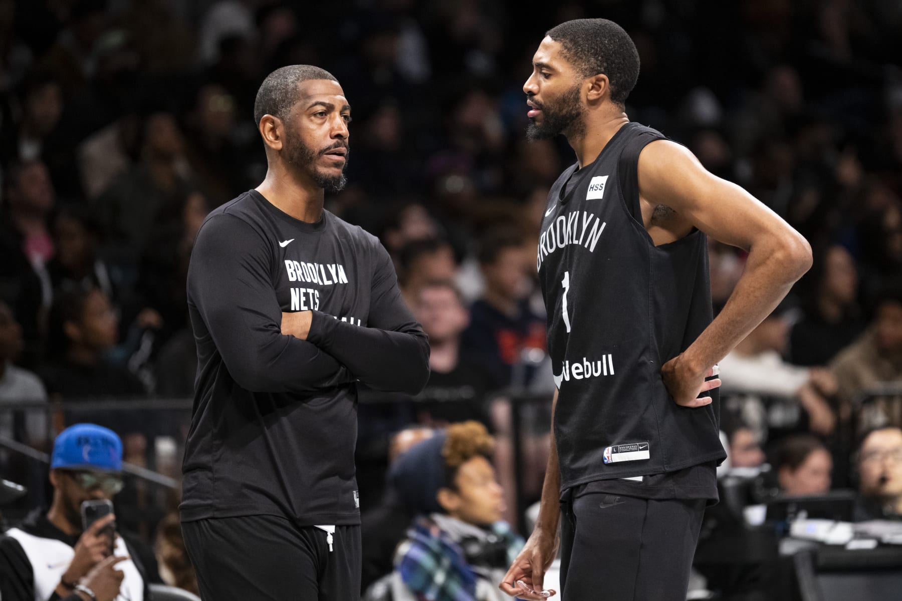 Kevin Ollie, left, and Mikal Bridges