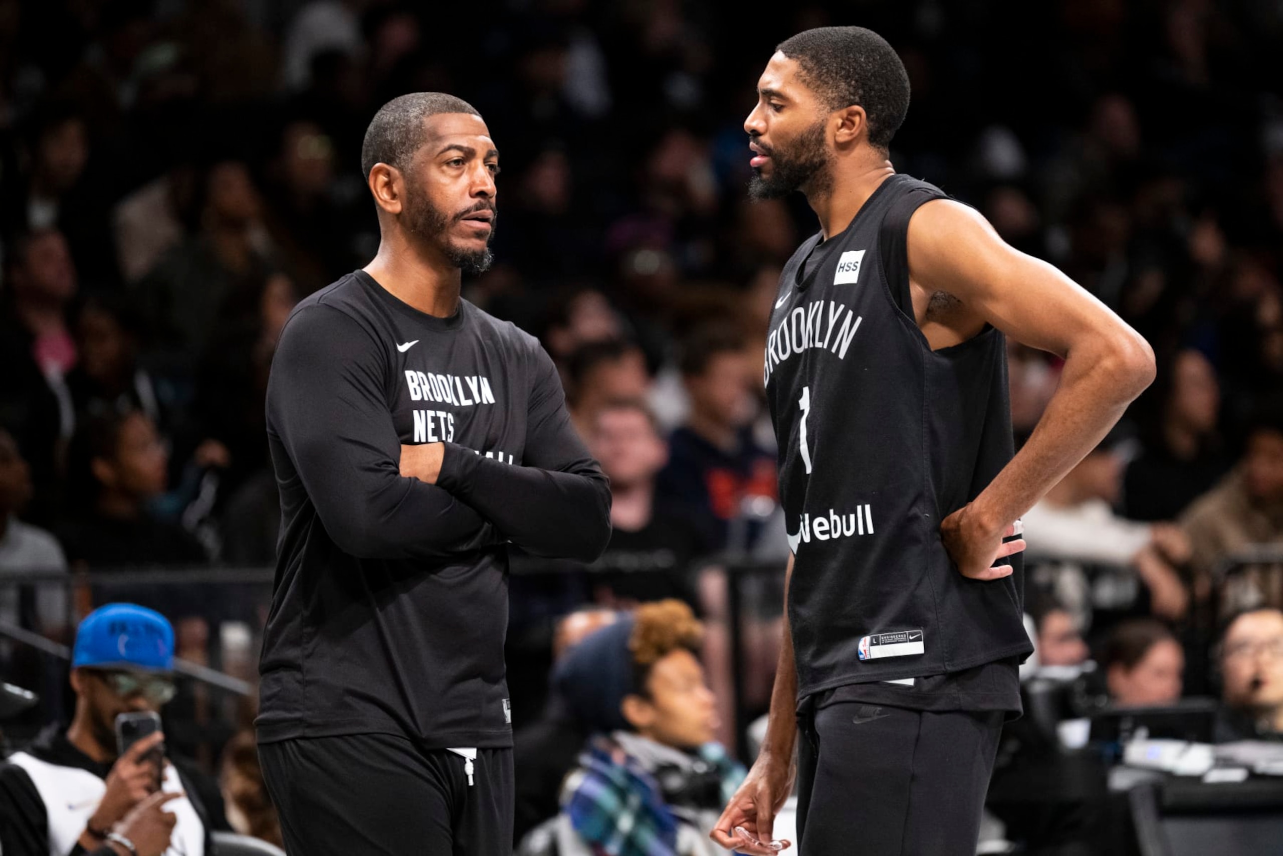 Kevin Ollie, left, and Mikal Bridges