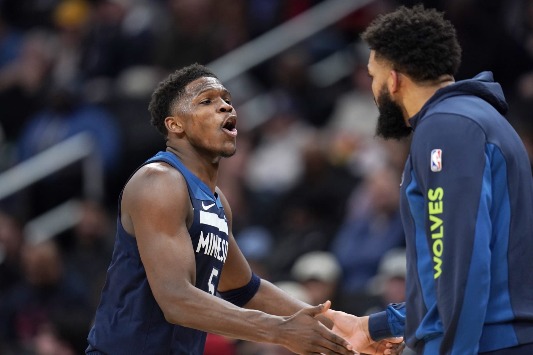 WASHINGTON, DC - JANUARY 24: Anthony Edwards #5 of the Minnesota Timberwolves celebrates with Karl-Anthony Towns #32 during a timeout in the second half against the Washington Wizards at Capital One Arena on January 24, 2024 in Washington, DC. NOTE TO USER: User expressly acknowledges and agrees that, by downloading and or using this photograph, User is consenting to the terms and conditions of the Getty Images License Agreement. (Photo by Jess Rapfogel/Getty Images)